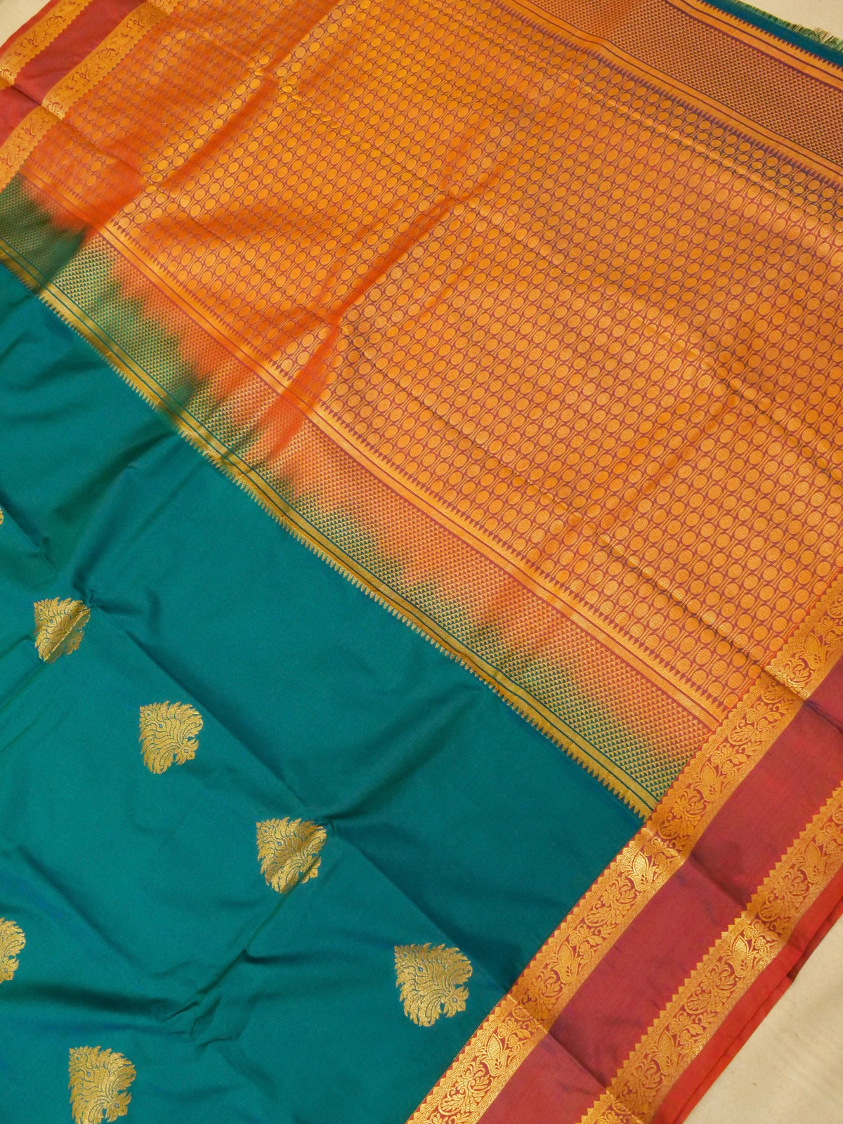 Devi - Peacock Teal Blue Kanjivaram Silk Saree with Korvai Border