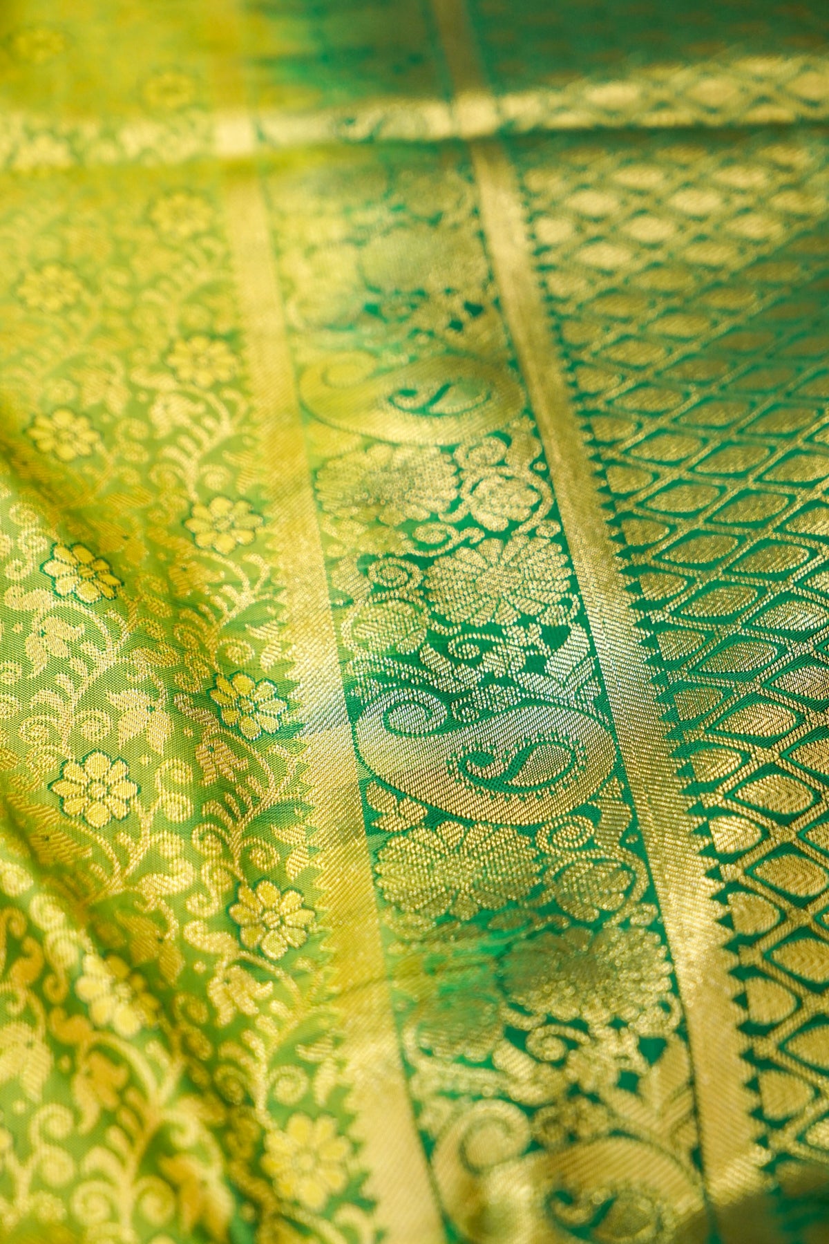 Devyani - Lime Green Kanchi Pattu Silk Saree with Emerald Green Border