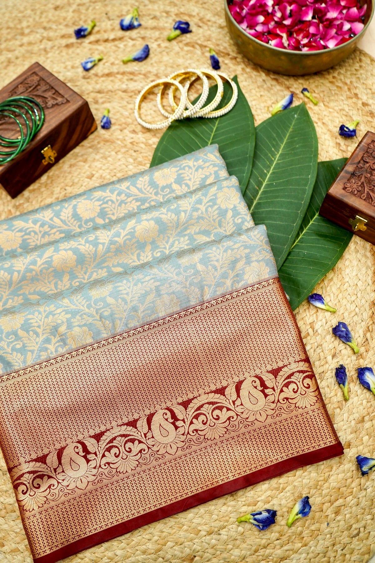 Devyani - Powder Blue Kanchi Pattu Silk Saree with Deep Maroon Korvai Border