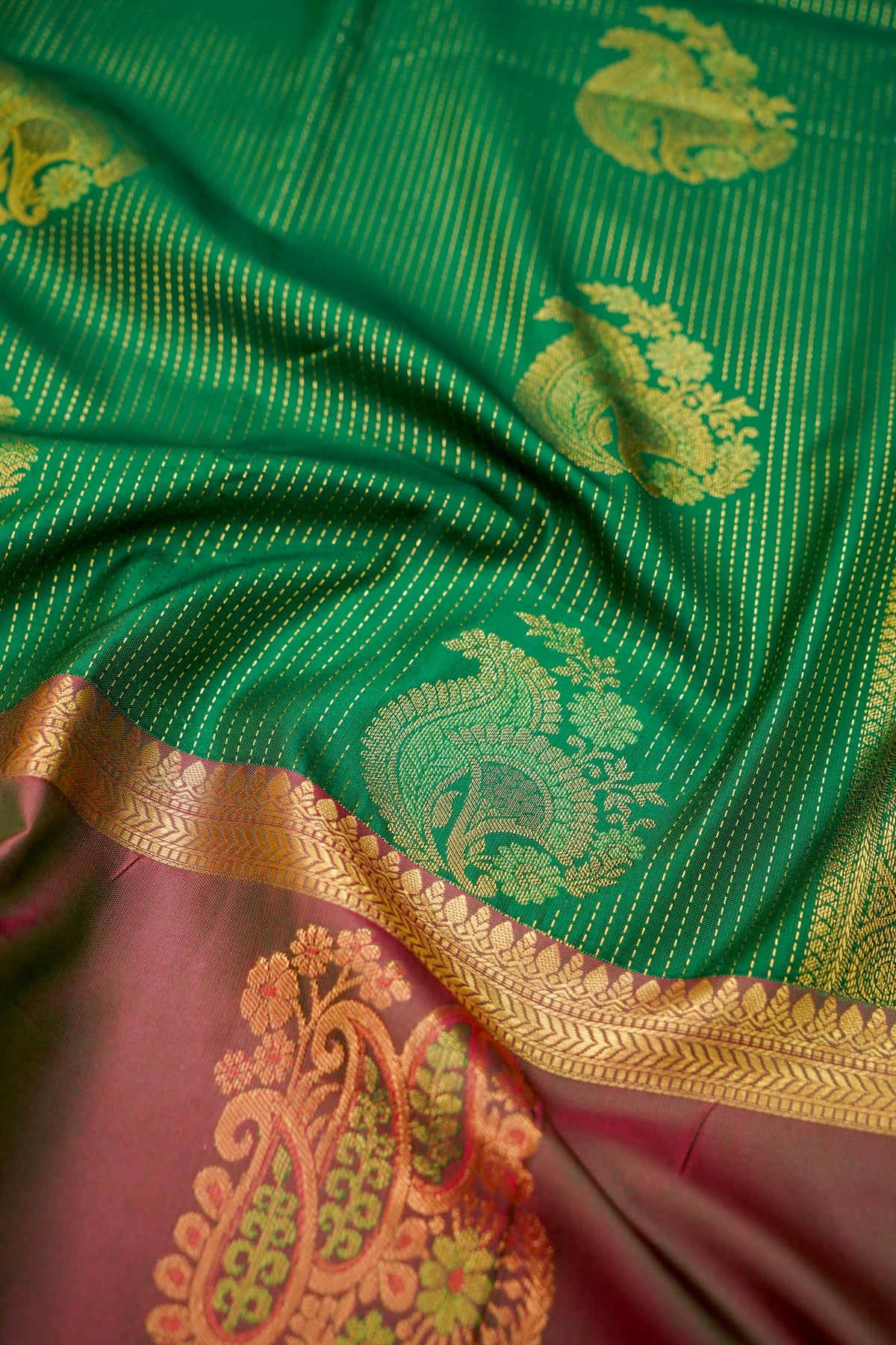 Devyani - Emerald Green Kanjivaram Silk Saree with Mauve Korvai Border