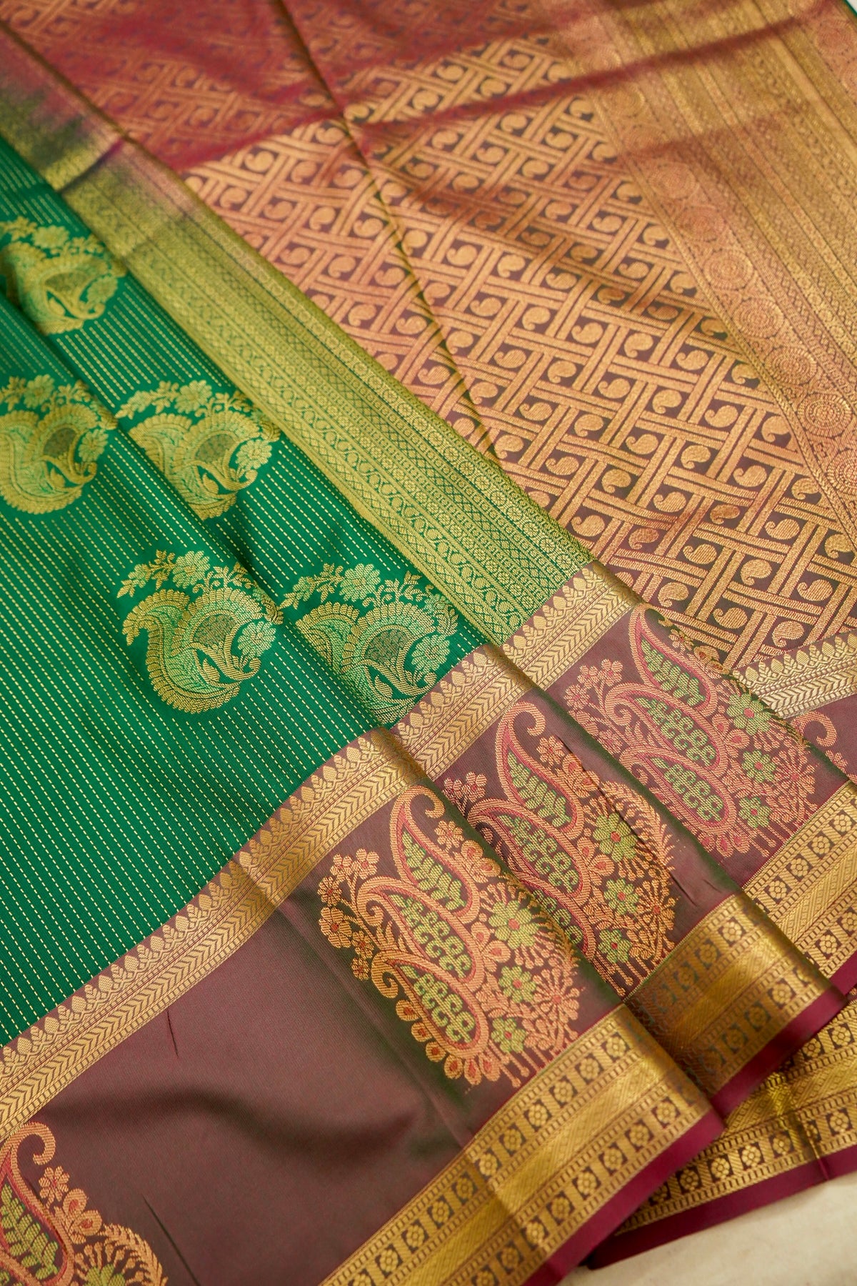 Devyani - Emerald Green Kanjivaram Silk Saree with Mauve Korvai Border
