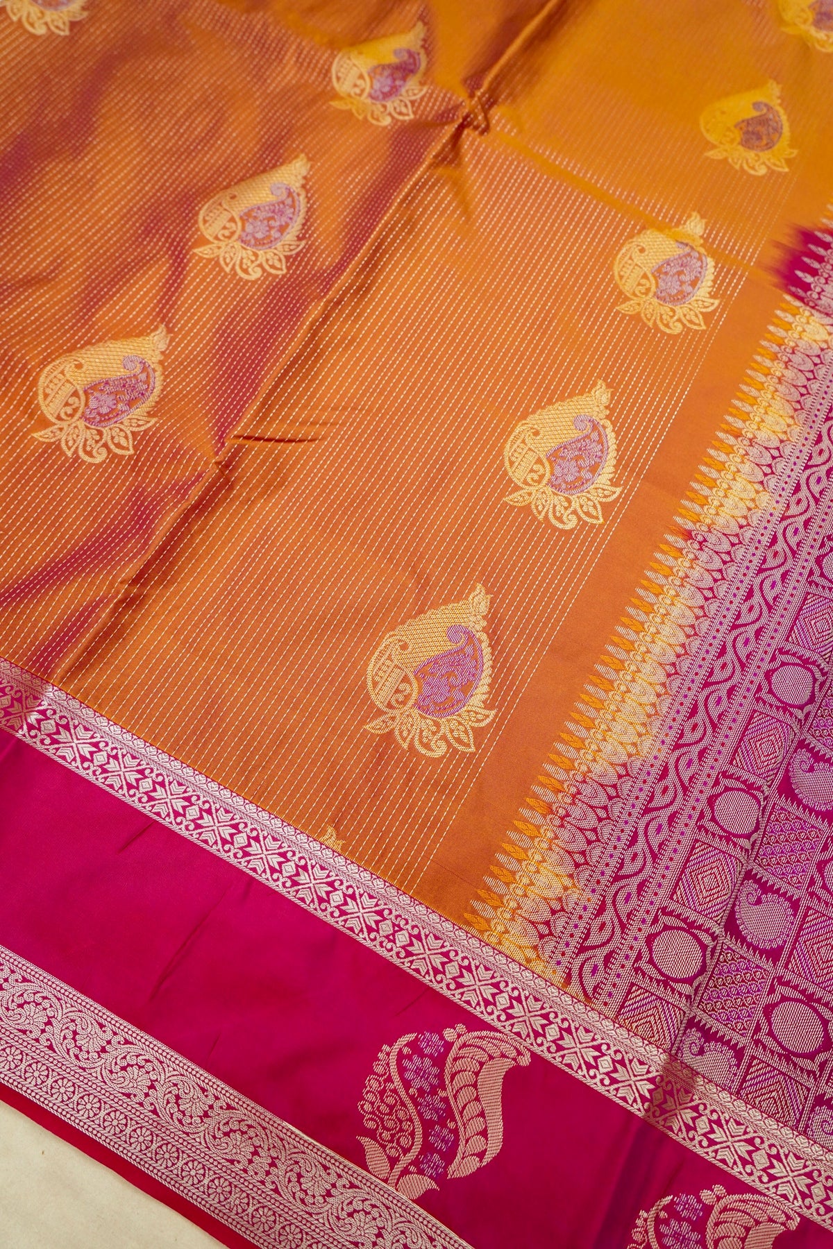 Devyani - Copper Orange Kanjivaram Silk Saree with Pink Korvai Border