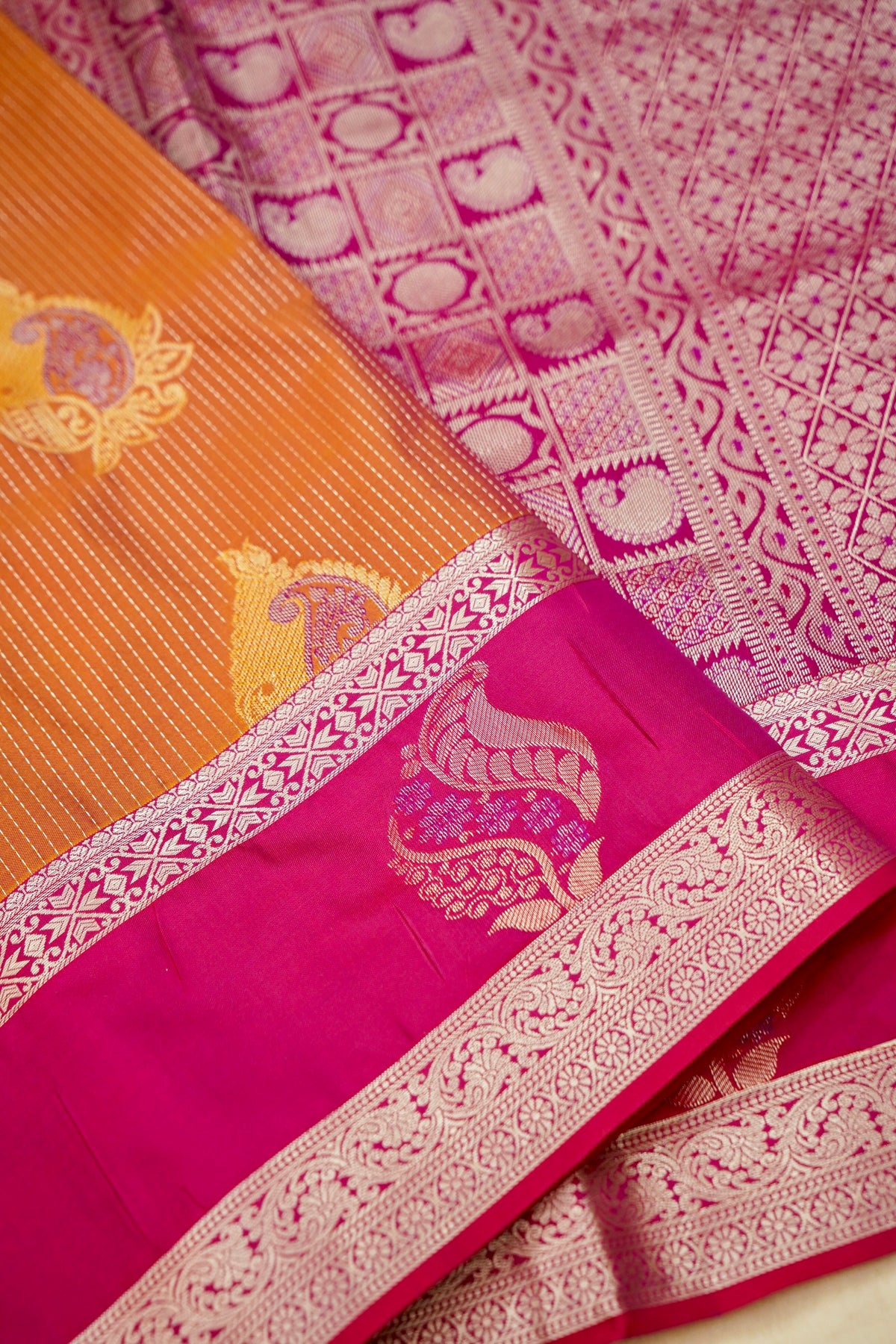 Devyani - Copper Orange Kanjivaram Silk Saree with Pink Korvai Border