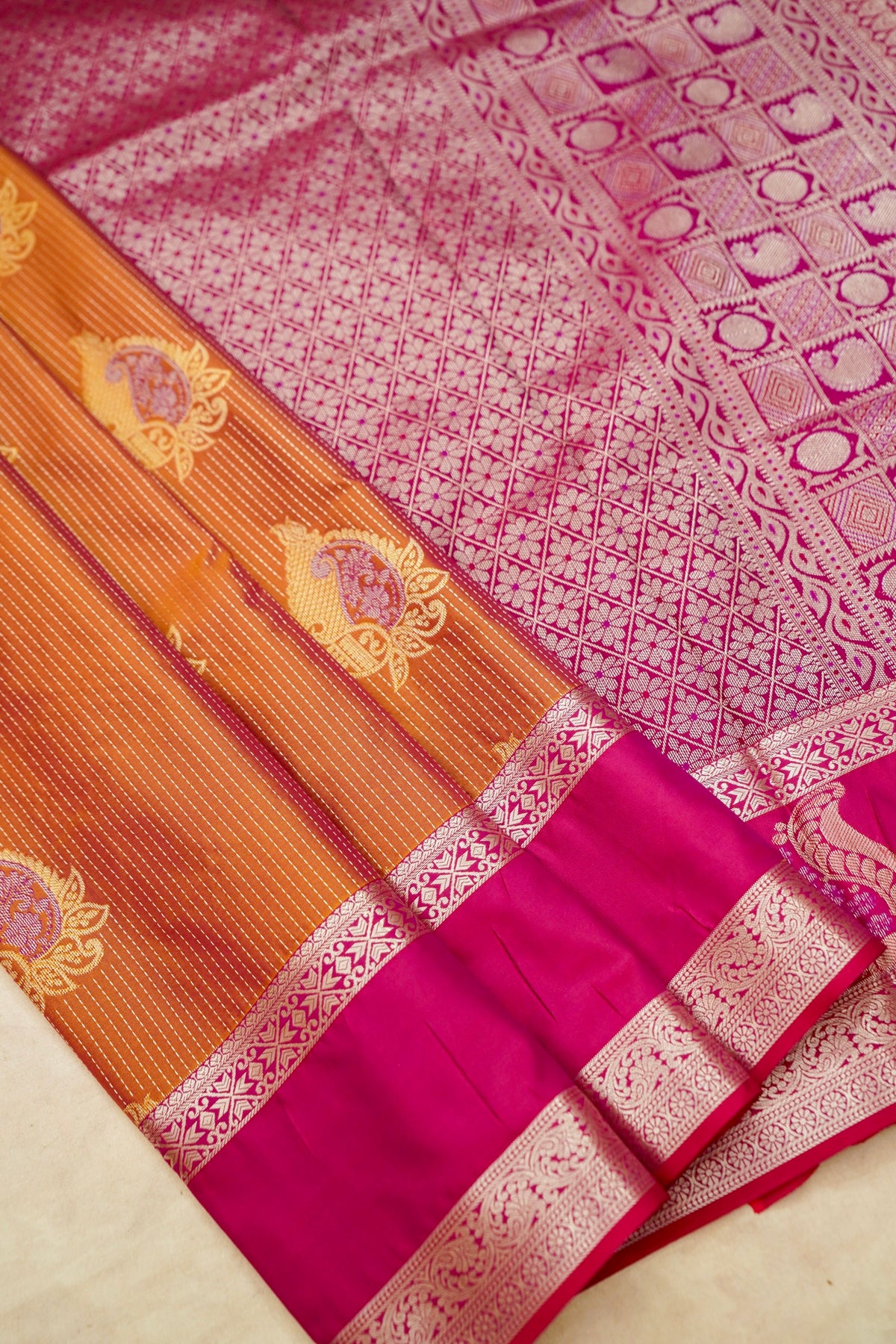 Devyani - Copper Orange Kanjivaram Silk Saree with Pink Korvai Border