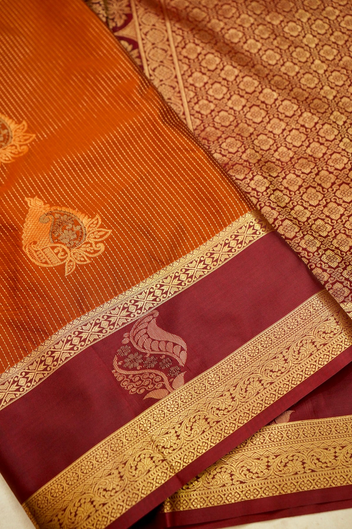 Devyani - Rust Orange Kanjivaram Silk Saree with Burgundy Korvai Border