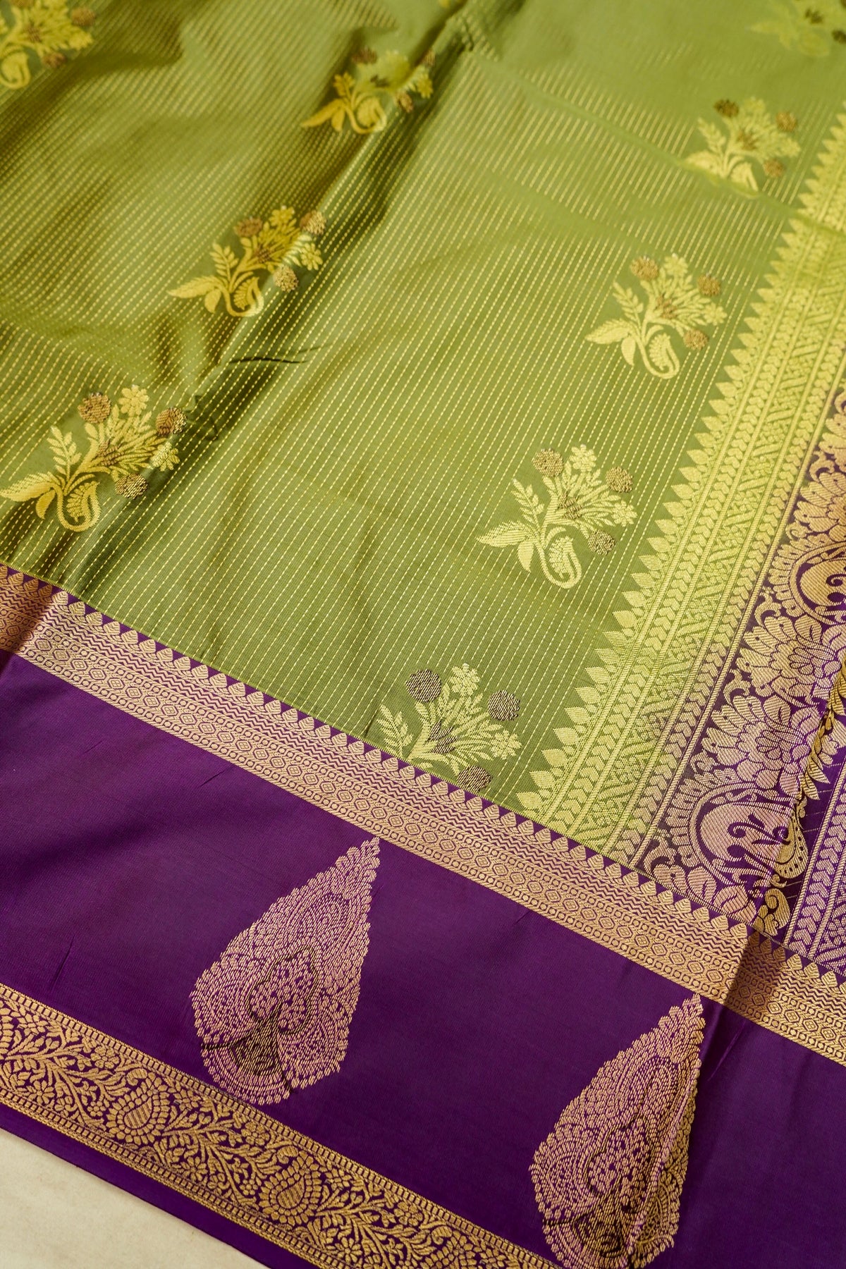 Devyani - Olive Green Kanjivaram Silk Saree with Purple Korvai Border