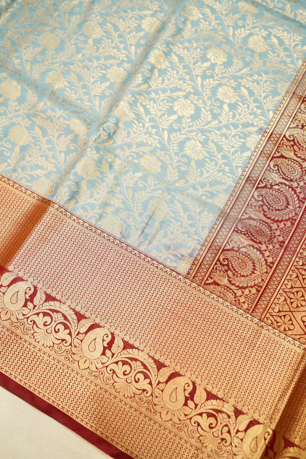 Devyani - Powder Blue Kanchi Pattu Silk Saree with Deep Maroon Korvai Border