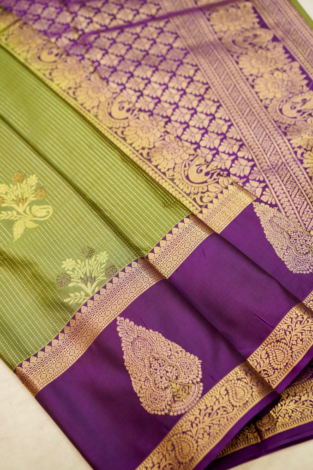 Devyani - Olive Green Kanjivaram Silk Saree with Purple Korvai Border
