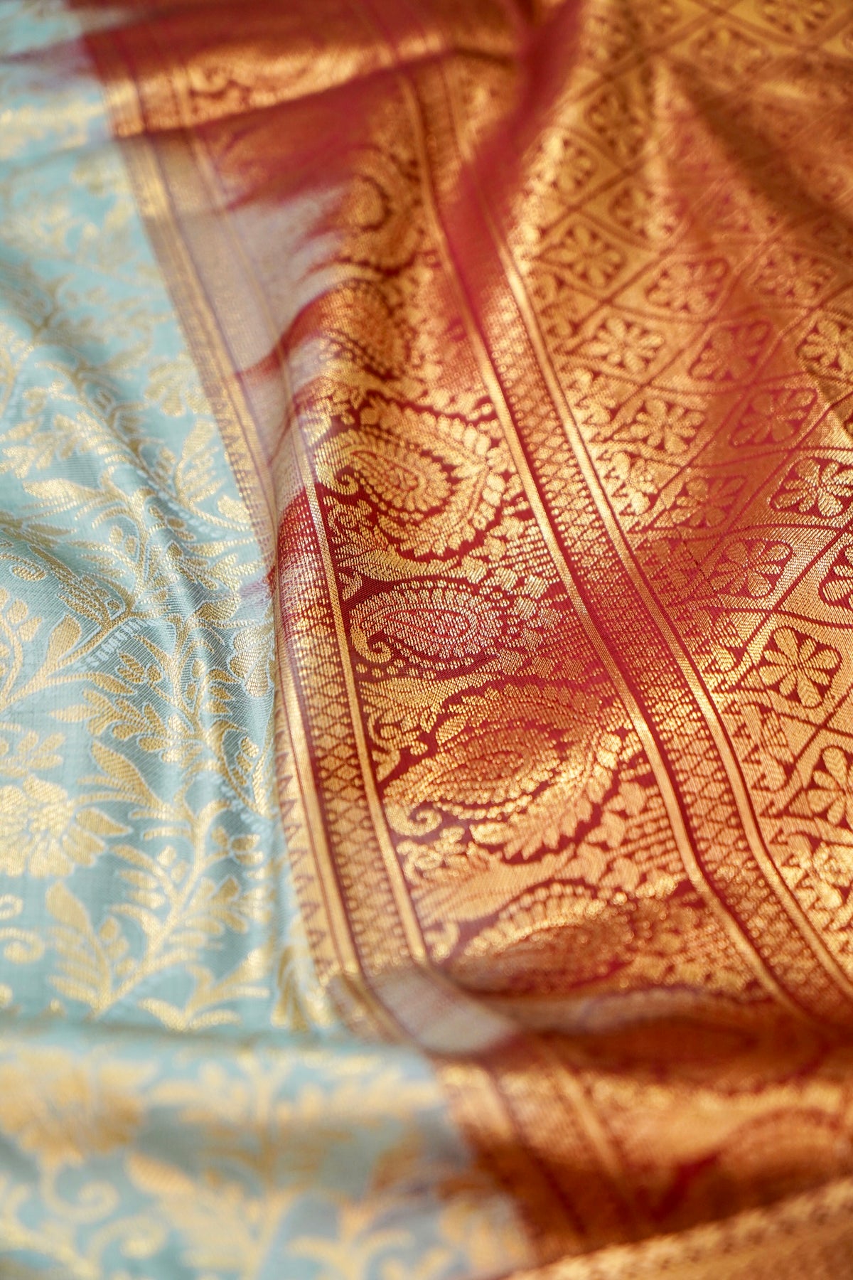 Devyani - Powder Blue Kanchi Pattu Silk Saree with Deep Maroon Korvai Border