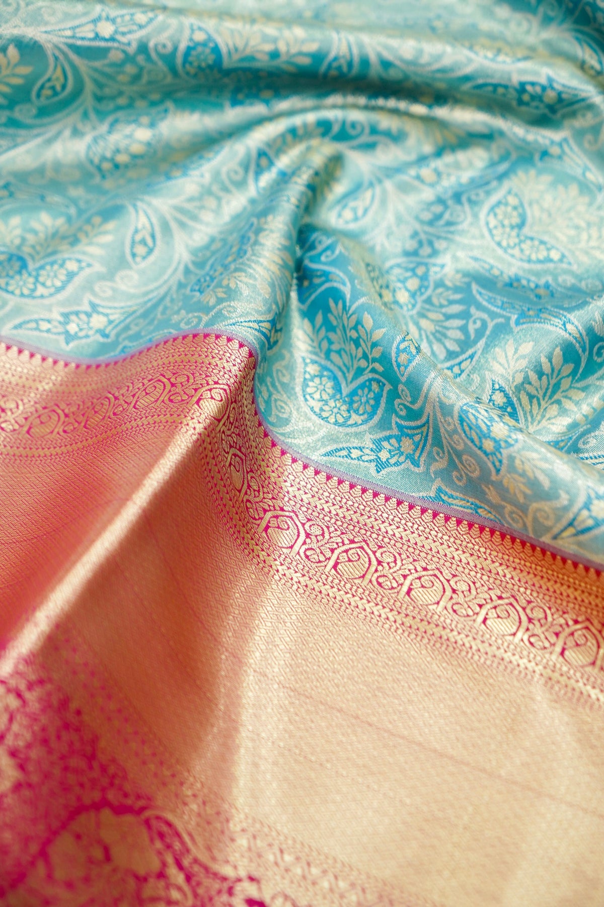 Devyani - Aqua Blue Kanchi Pattu Silk Saree with Rani Pink Korvai Border