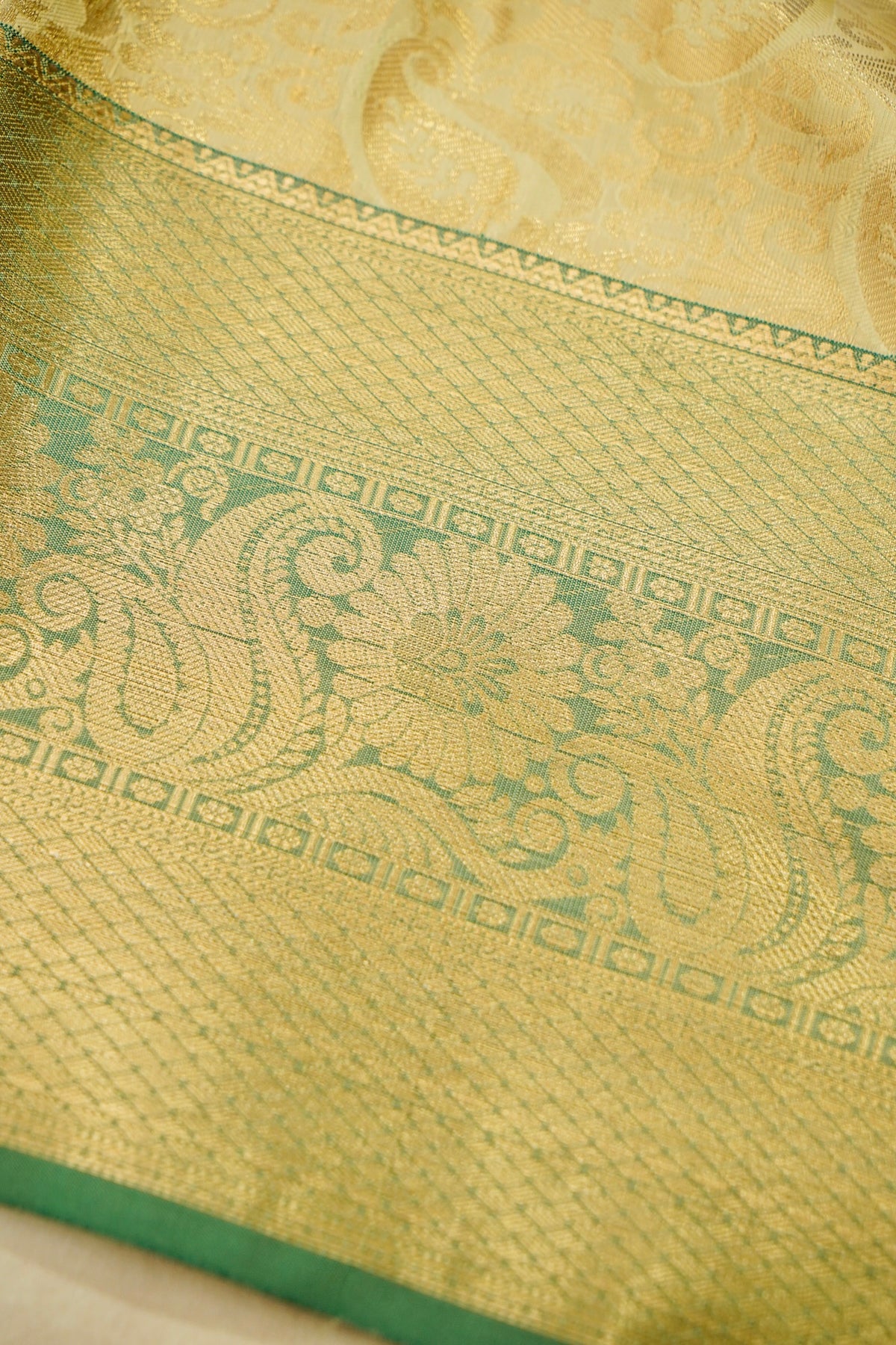 Devyani - Pastel Yellow Kanchi Pattu Silk Saree with Green Border