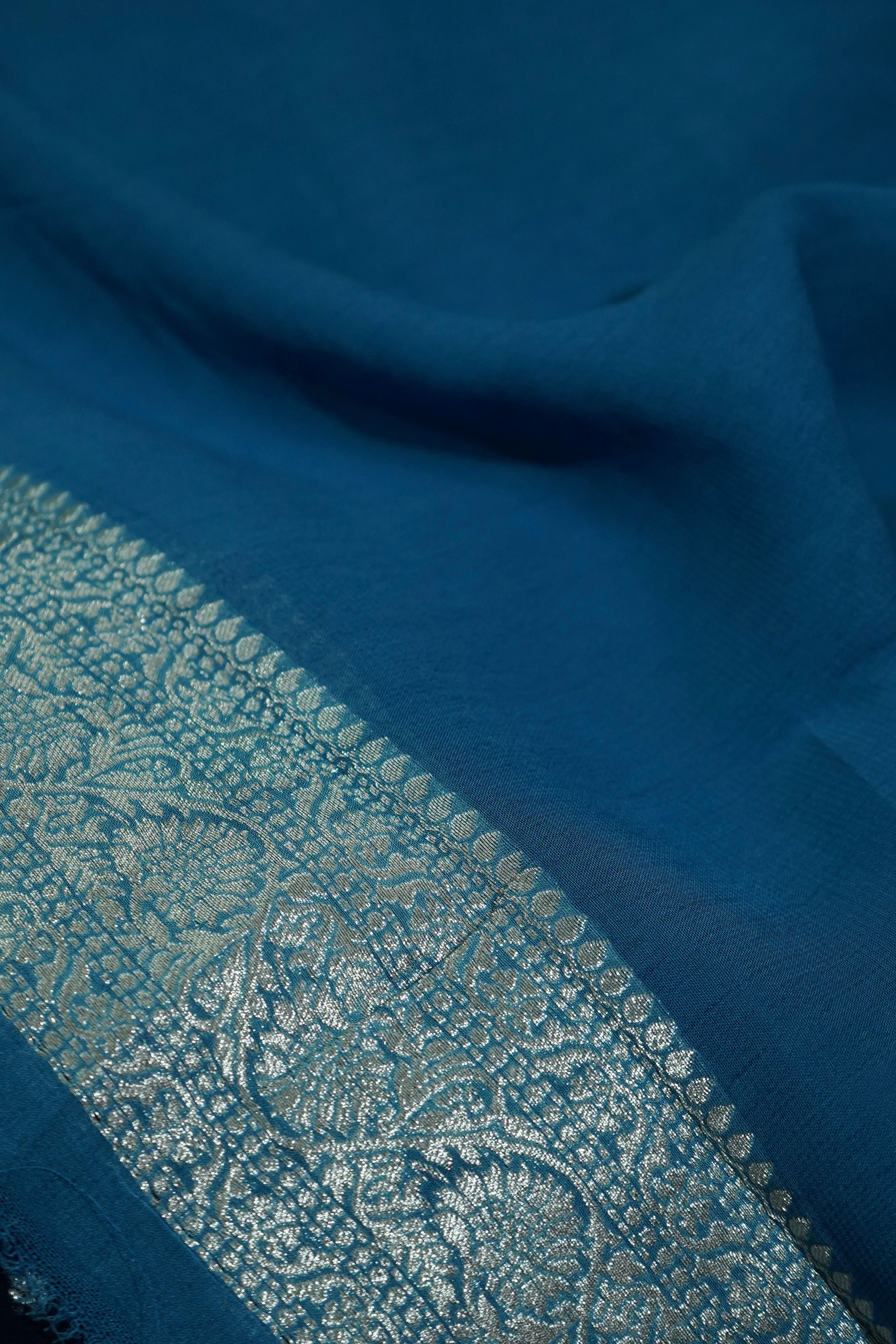 Navy Blue Khaddi Georgette Pure Banarasi Saree with Icy Blue and Champagne Zari Border