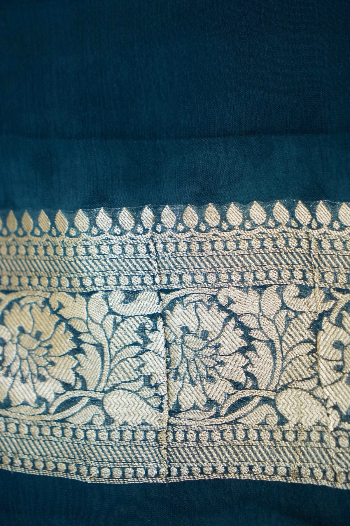 Deep Teal Blue Khaddi Georgette Pure Banarasi Saree with Champagne Zari Border