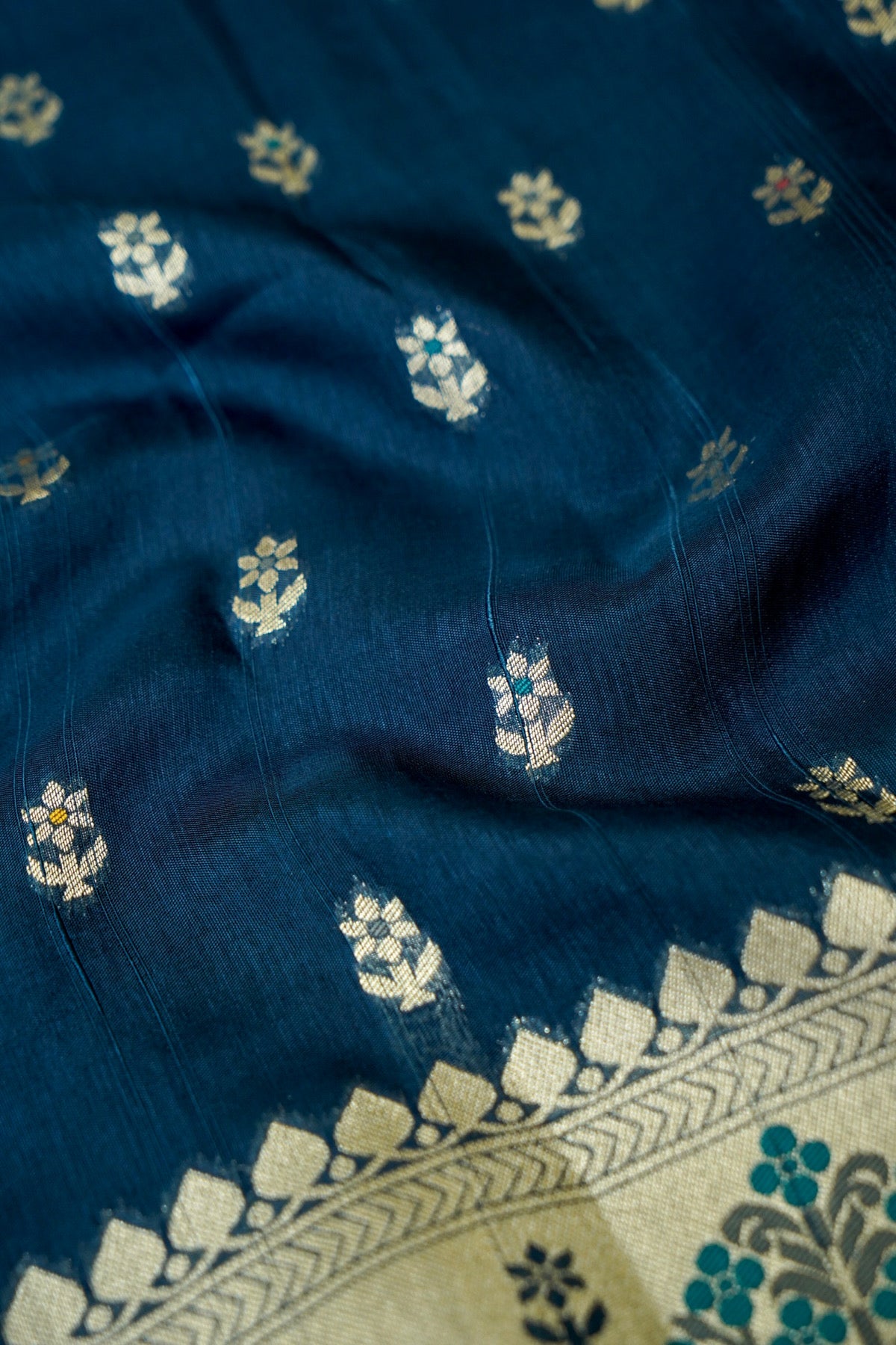 Teal Blue Raw Silk Saree with Multicolor Tree Weave Border