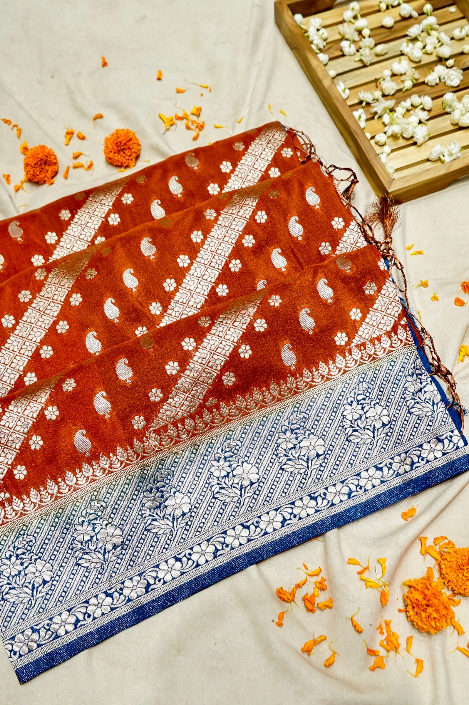 Rust Orange Paisley Crepe Georgette Silk Saree with Cobalt Blue Border
