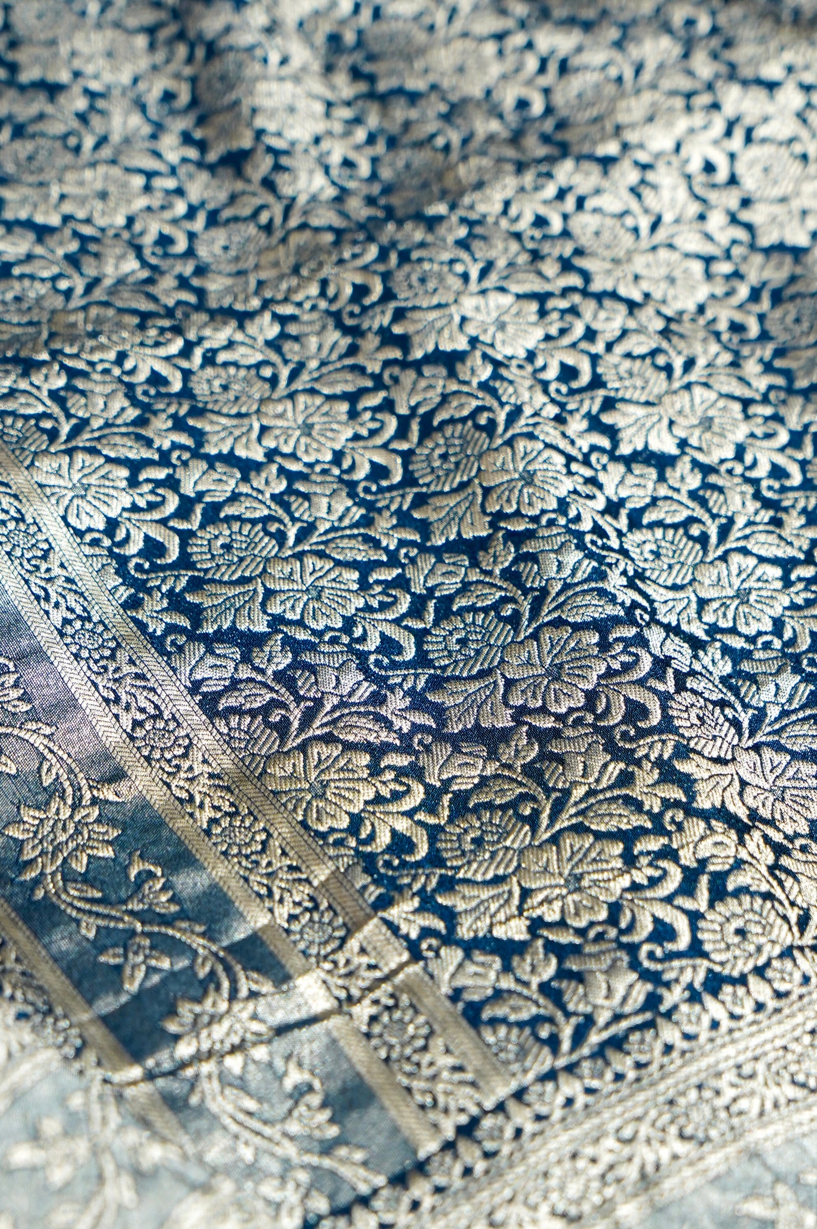 Peach Crepe Georgette Silk Saree with Floral Navy Blue Border