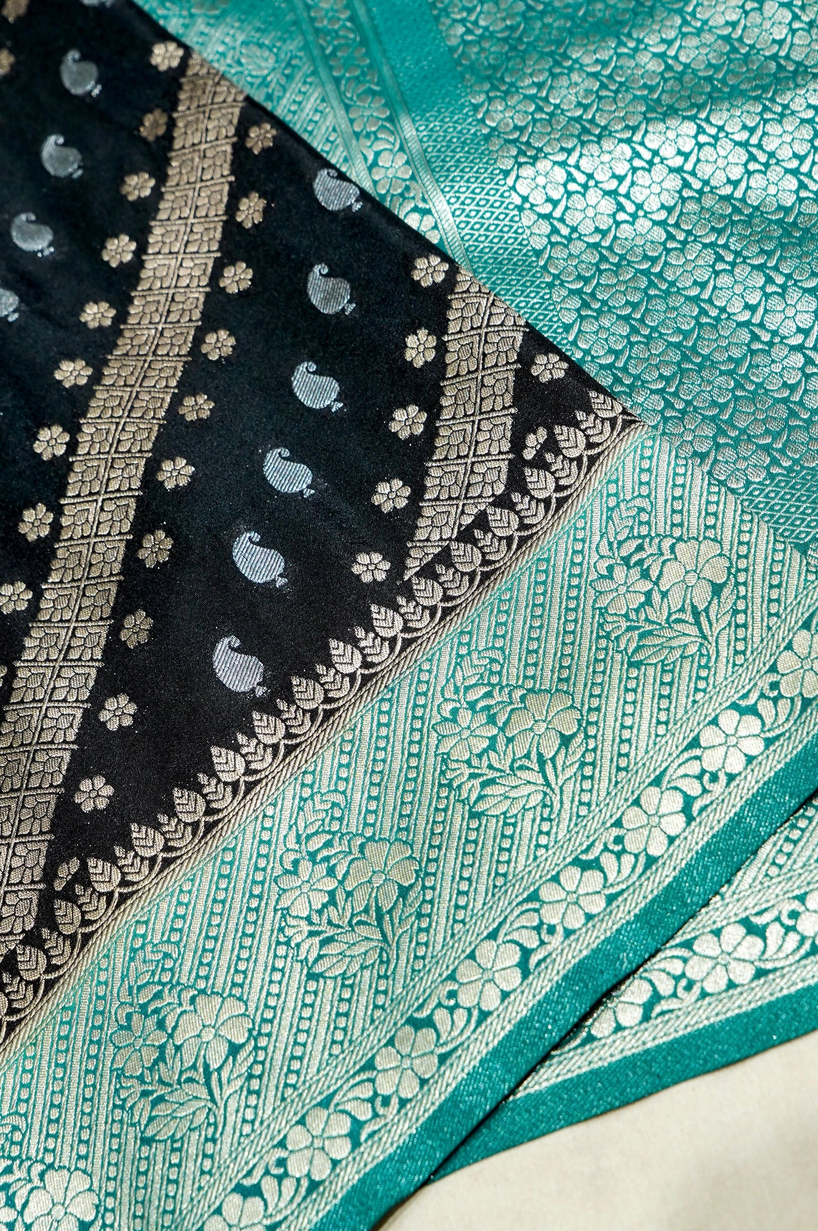 Jet Black Paisley Crepe Georgette Silk Saree with Sea Green Border