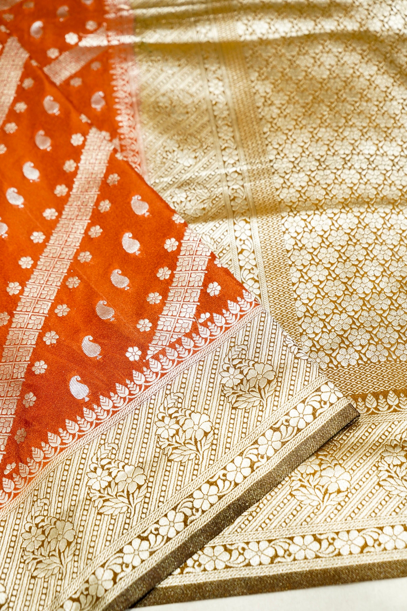 Rust Orange Paisley Crepe Georgette Silk Saree with Mustard Gold Border