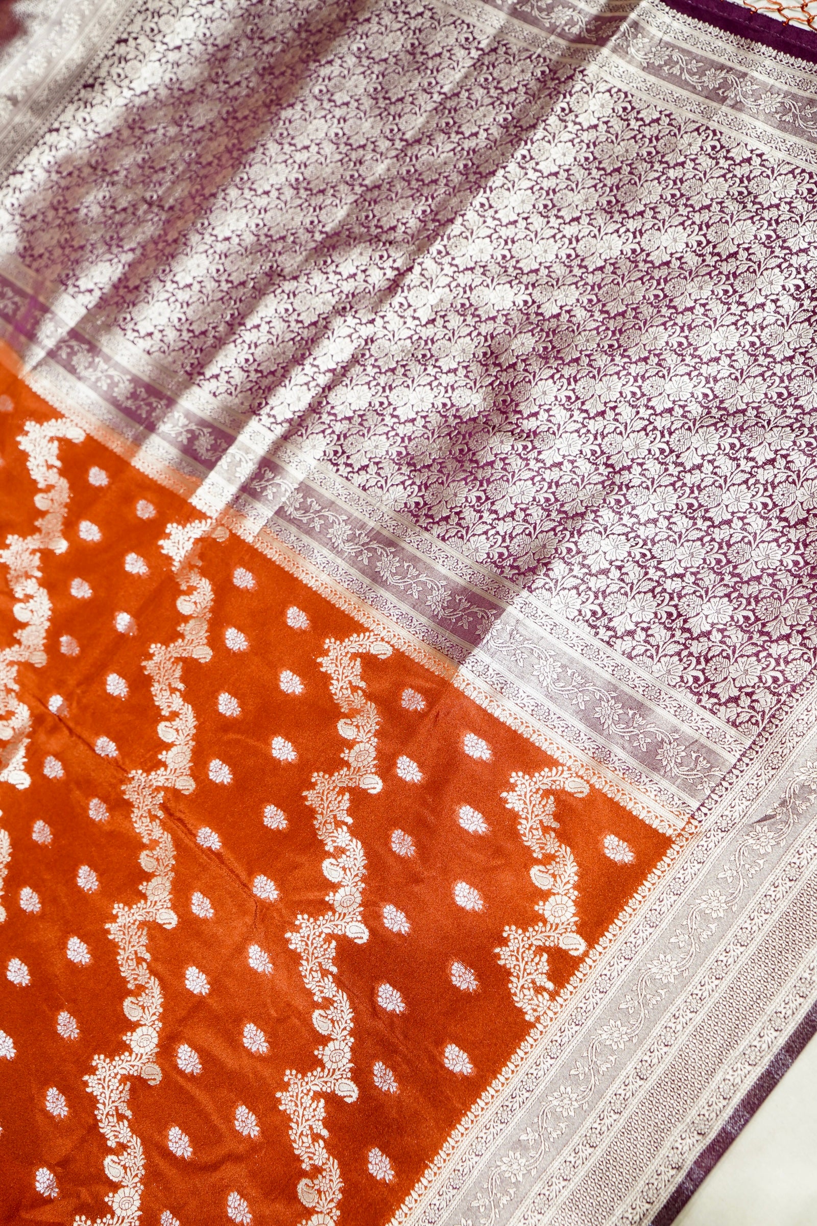 Vibrant Orange Crepe Georgette Silk Saree with Floral Wine Border