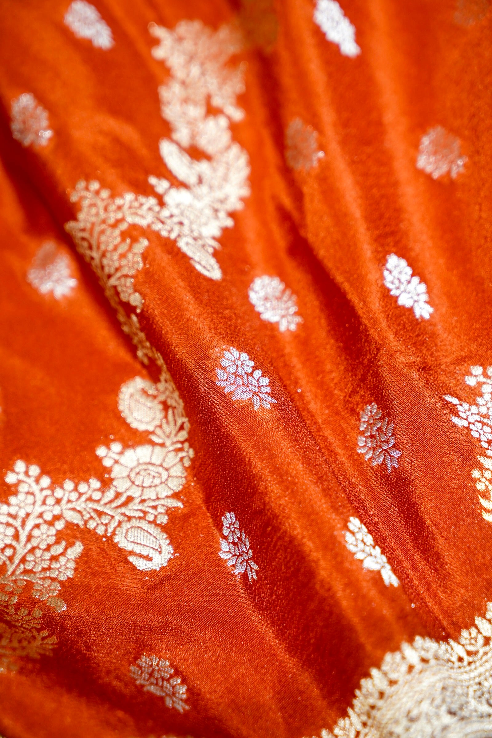 Vibrant Orange Crepe Georgette Silk Saree with Floral Wine Border