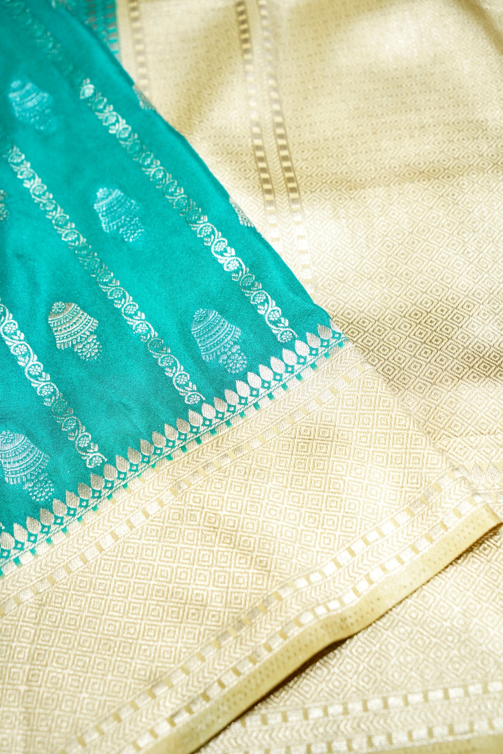 Aqua Green Bell Motifs Crepe Georgette Silk Saree with Champagne Border