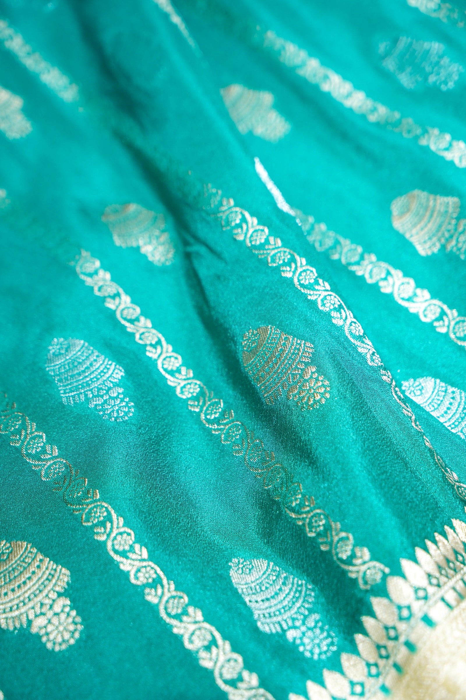 Aqua Green Bell Motifs Crepe Georgette Silk Saree with Champagne Border