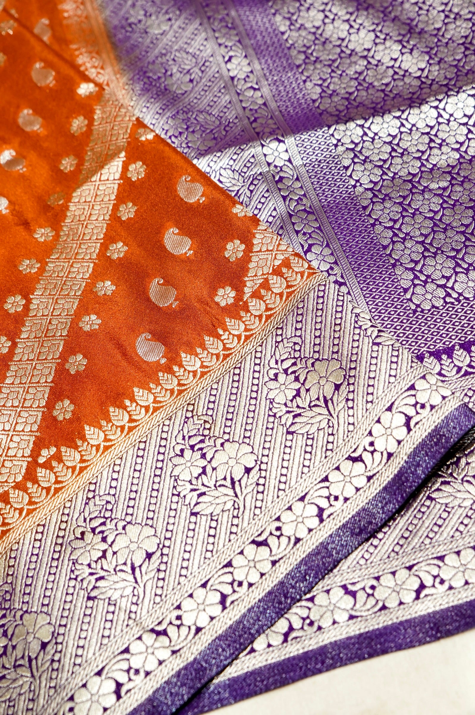Rust Orange Paisley Crepe Georgette Silk Saree with Royal Purple Border