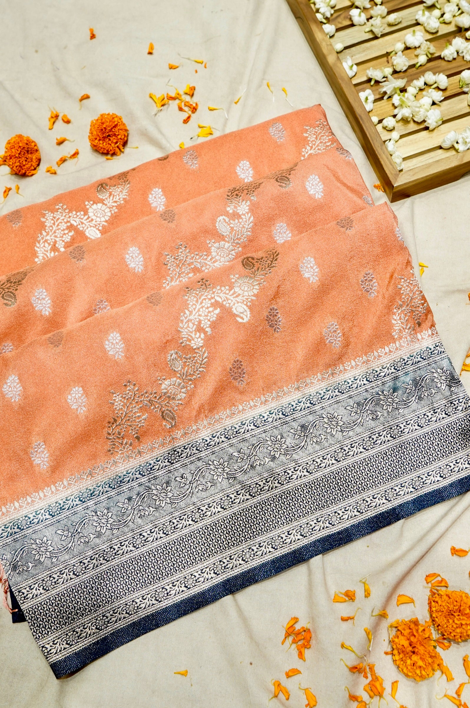 Peach Crepe Georgette Silk Saree with Floral Navy Blue Border