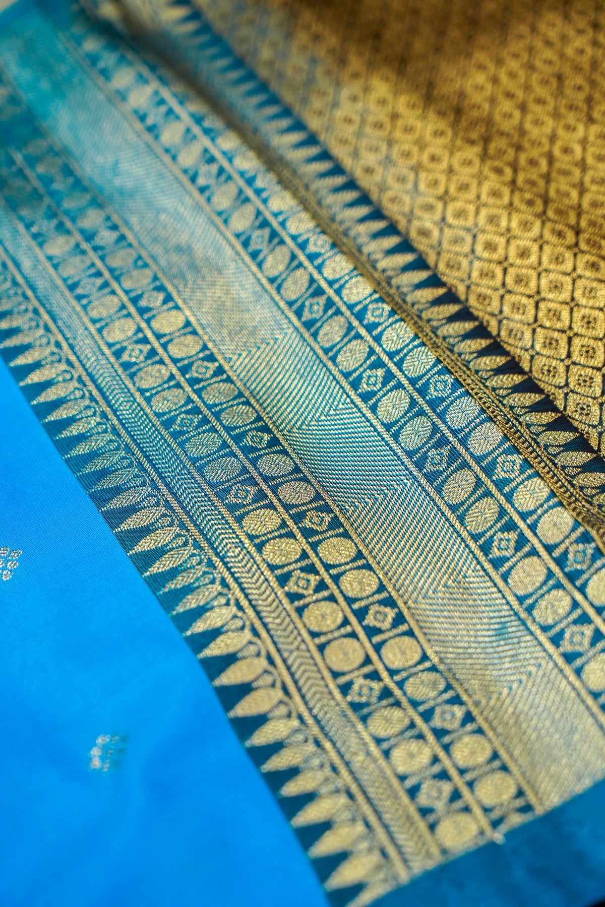 Suvarna - Bright Turquoise Blue Gadwal Silk Saree with Brown Gold Border