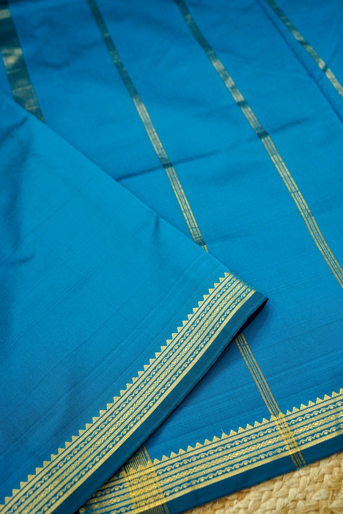 Suvarna - Peacock Blue Mysore Crepe Silk Saree with Gold Kaat Border