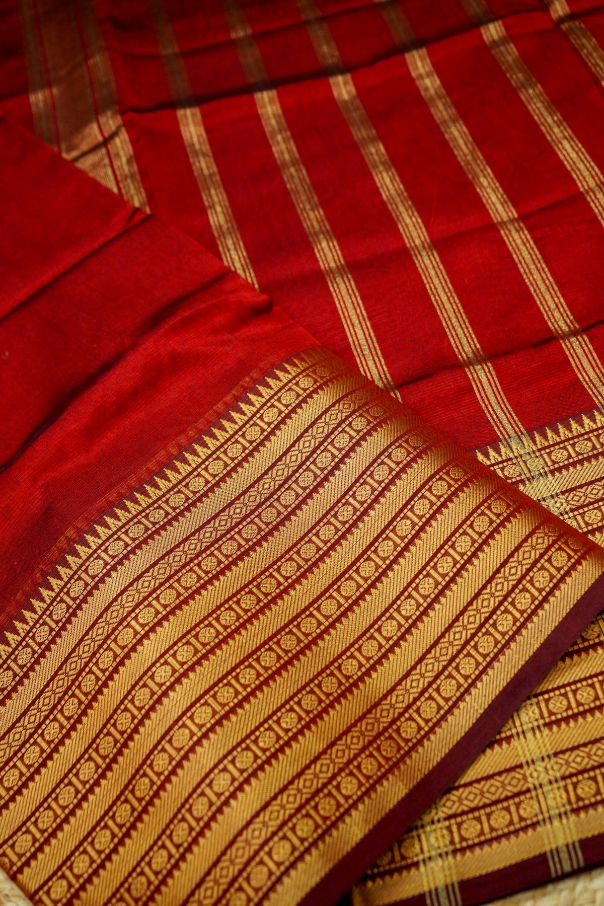 Suvarna - Ruby Red Gadwal Silk Saree with Antique Gold Zari Border