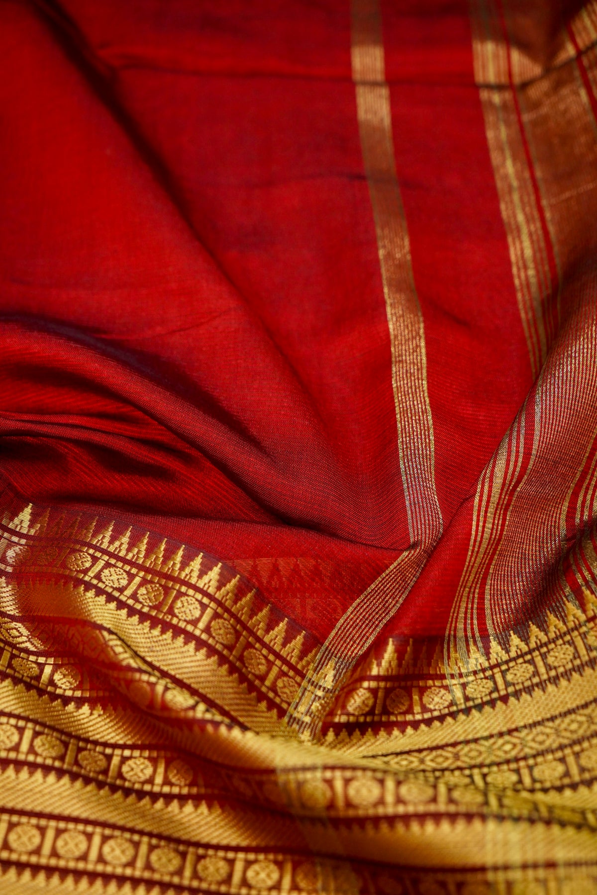 Suvarna - Ruby Red Gadwal Silk Saree with Antique Gold Zari Border
