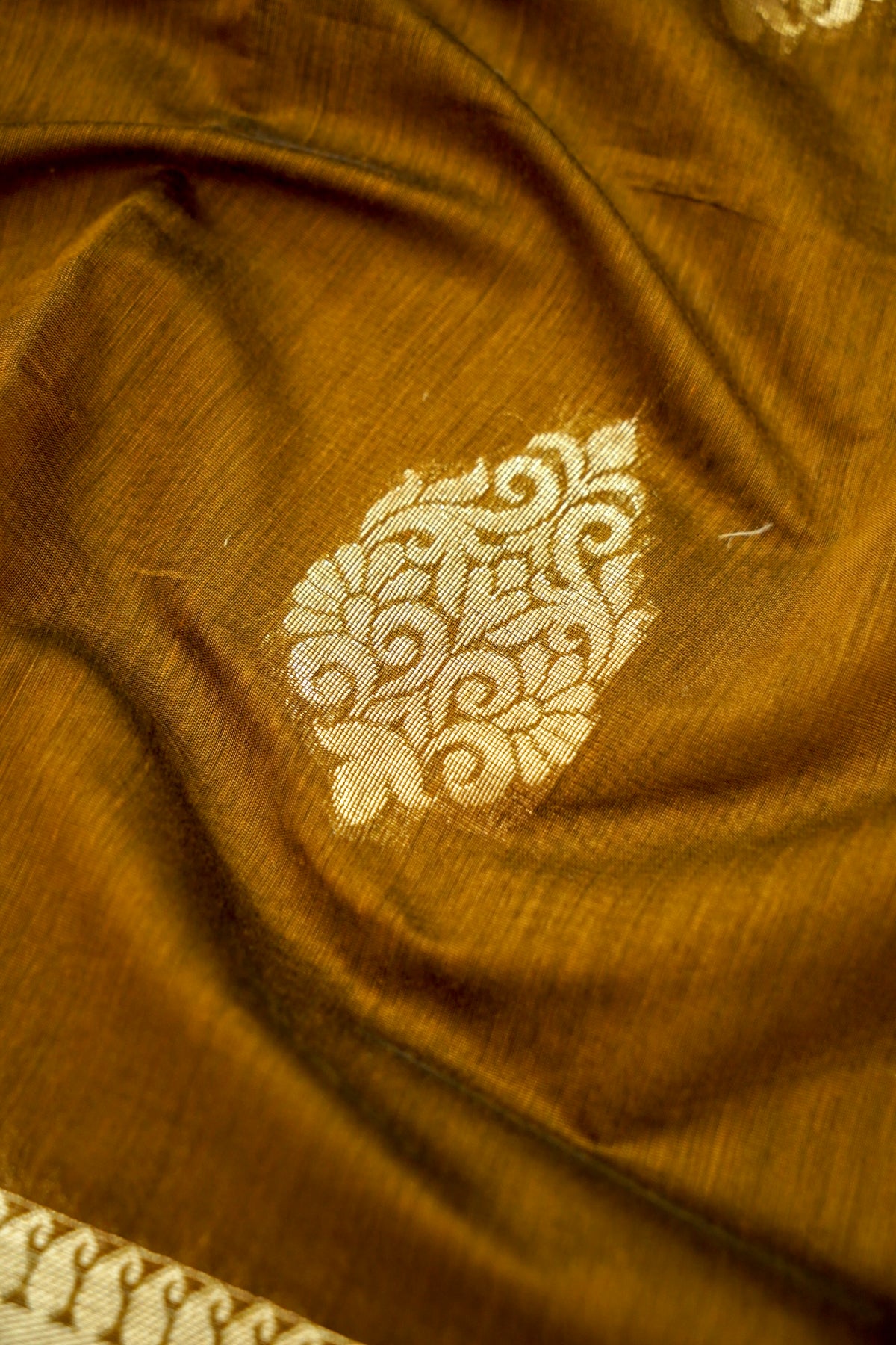 Suvarna - Rust Brown Maheshwari Silk Saree with Antique Gold Border