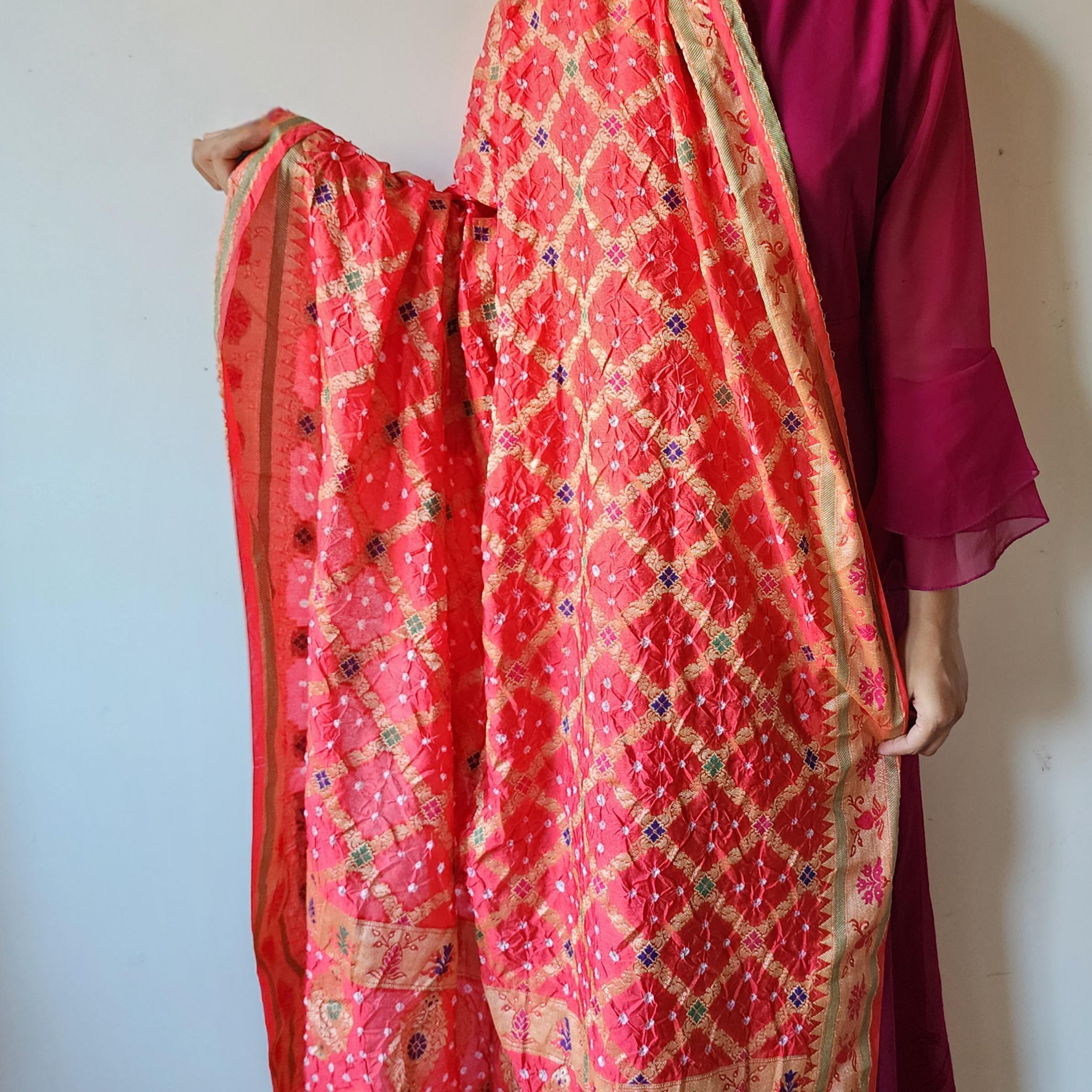 Tomato Red Bandhni Dupatta with Golden Border & Banarasi Meenakari Work