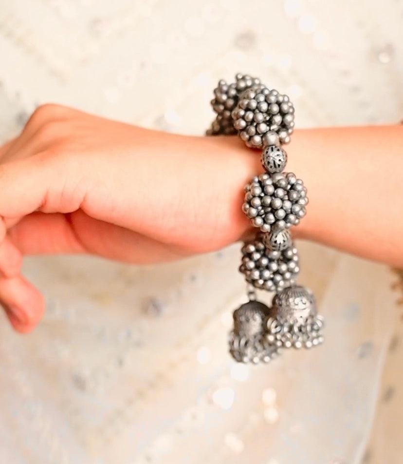 Handcrafted Oxidized Silver Gajra Bracelet with Floral Elements and Jhumka Charm for Ethnic Outfits