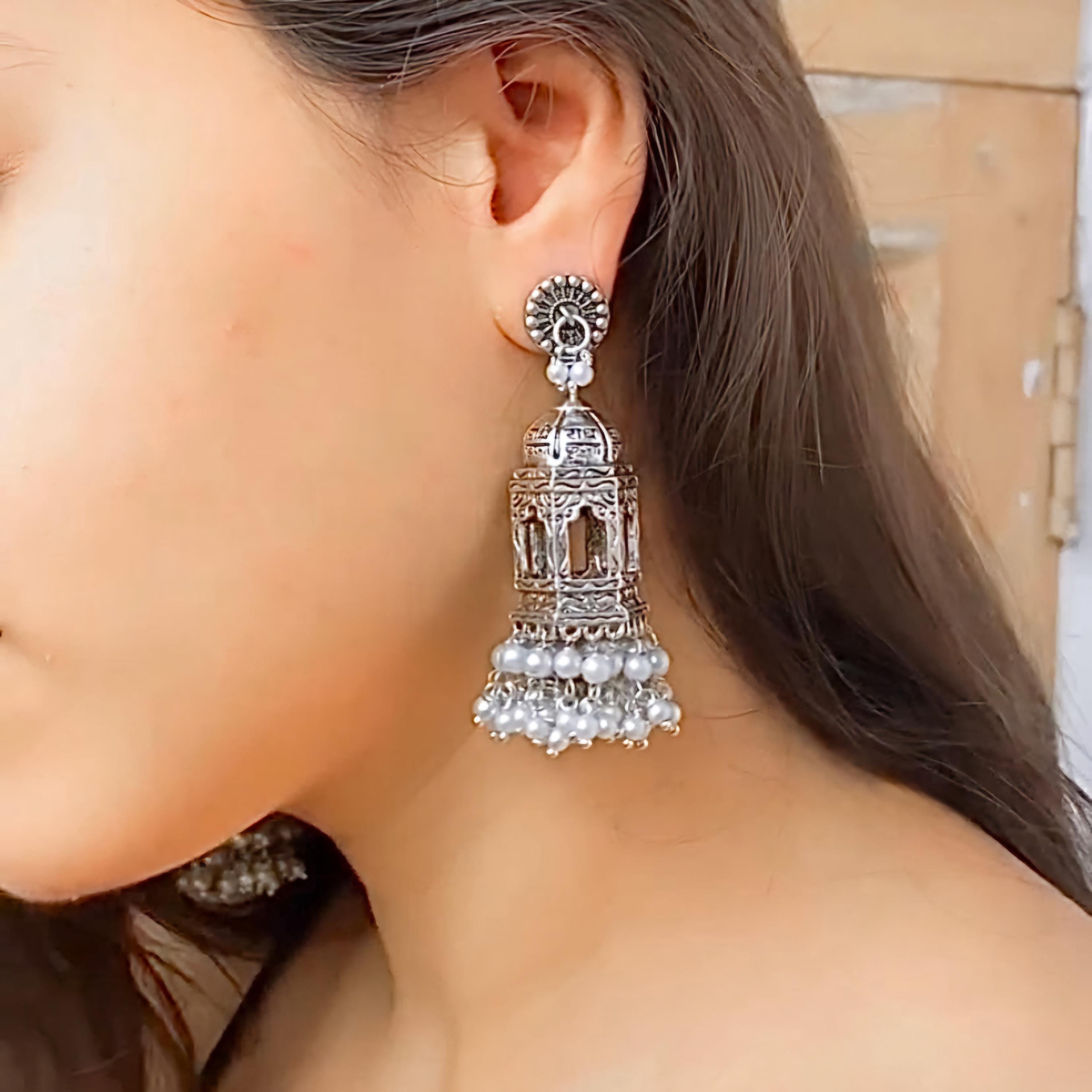 Temple Style Oxidized Silver Jhumkas with Traditional Architecture Motifs and Pearl Drops for Bridal Wear