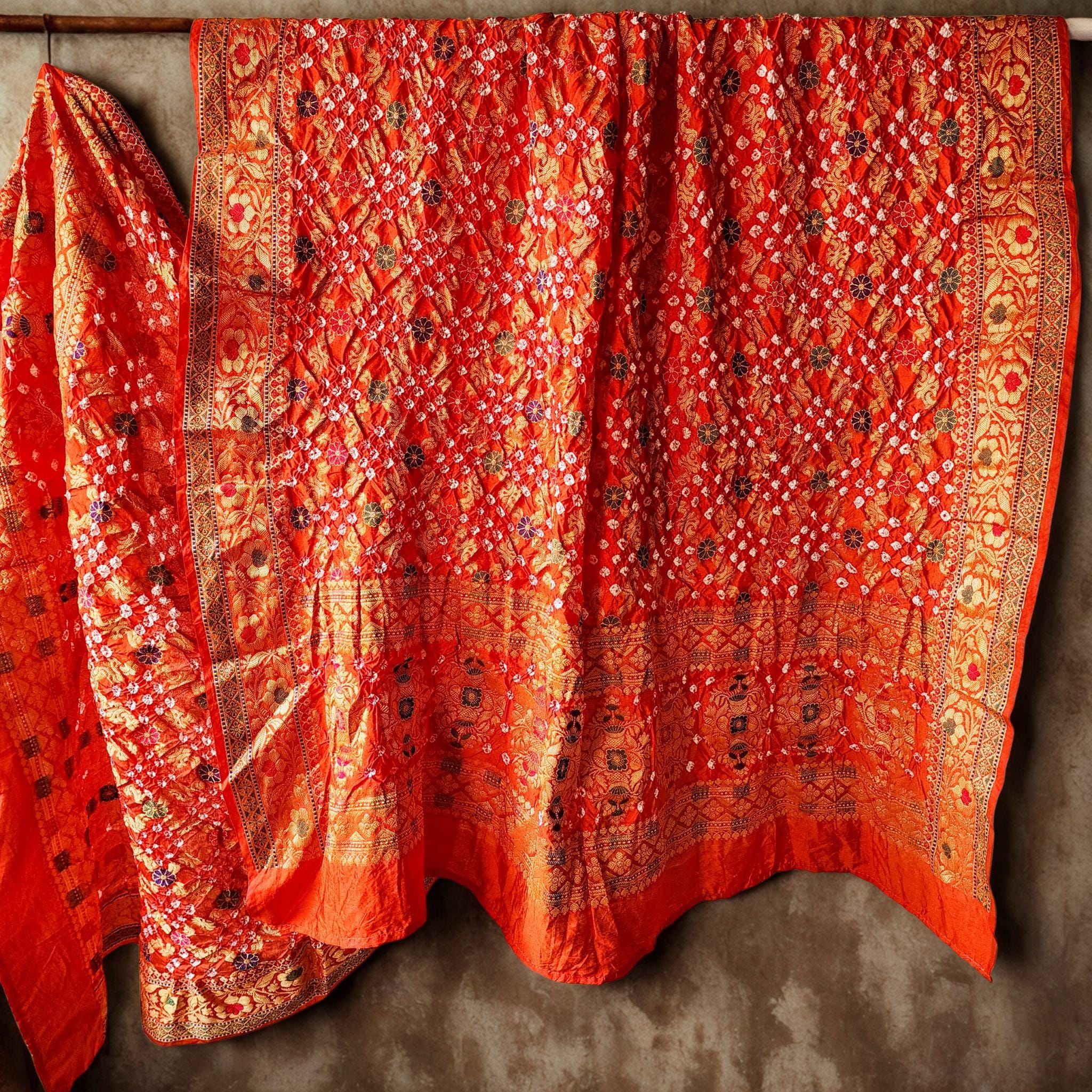 Orange Bandhni dupatta with Banarasi Meenakari work