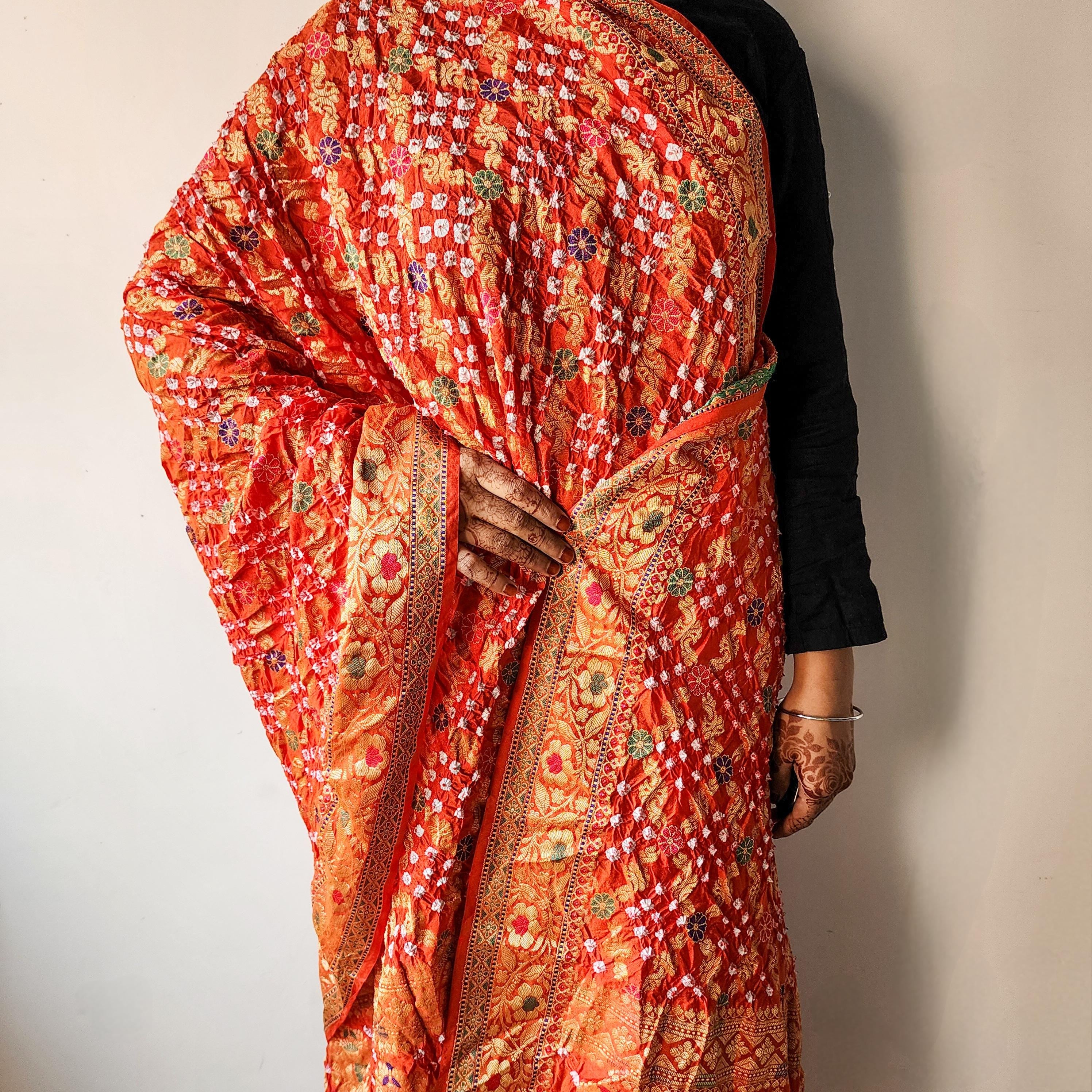 Orange Bandhni dupatta with Banarasi Meenakari work