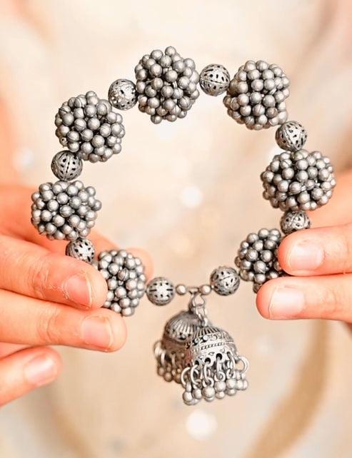 Handcrafted Oxidized Silver Gajra Bracelet with Floral Elements and Jhumka Charm for Ethnic Outfits