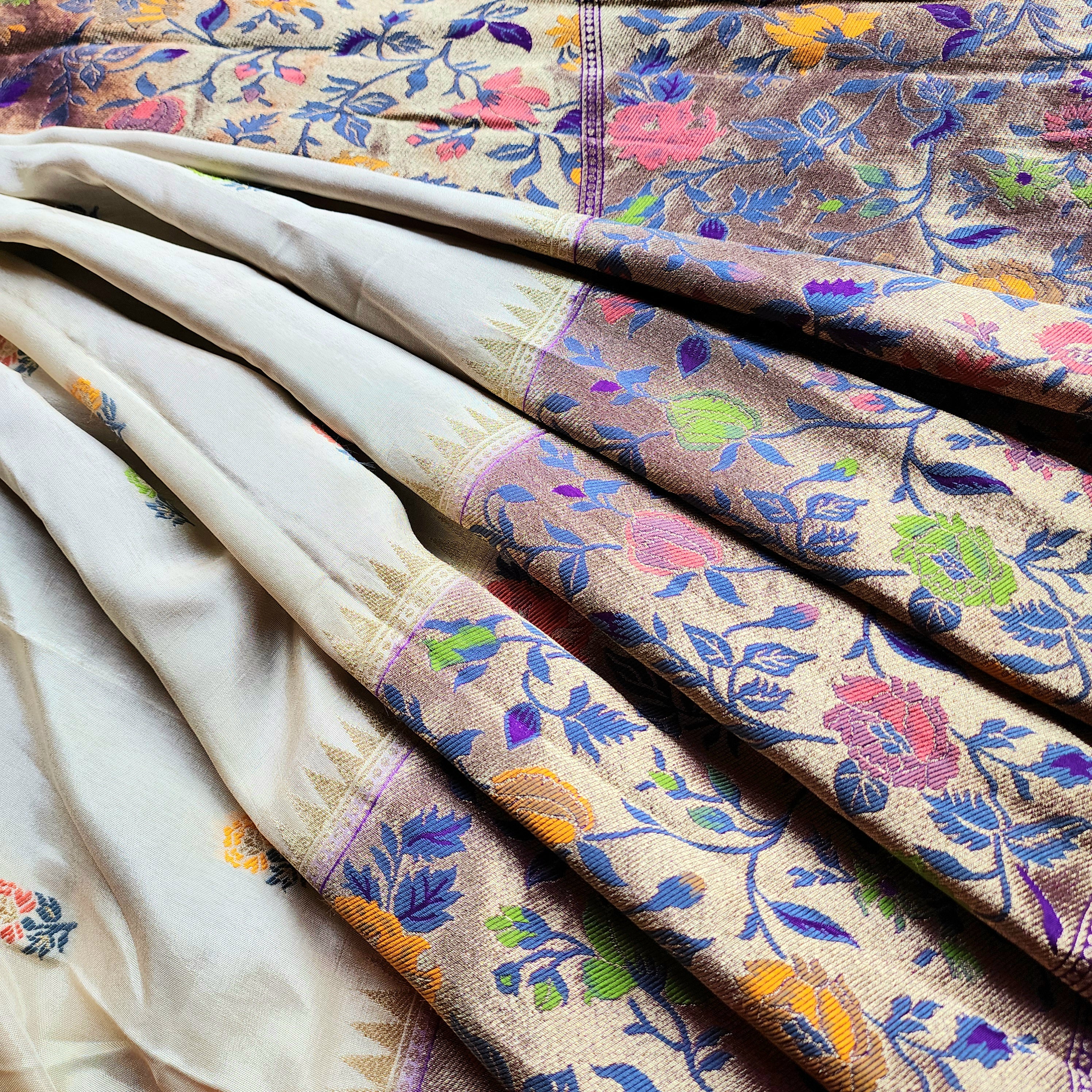 Soft Ivory Raw Silk Saree With Pastel Floral Weaving and Lilac Purple Border