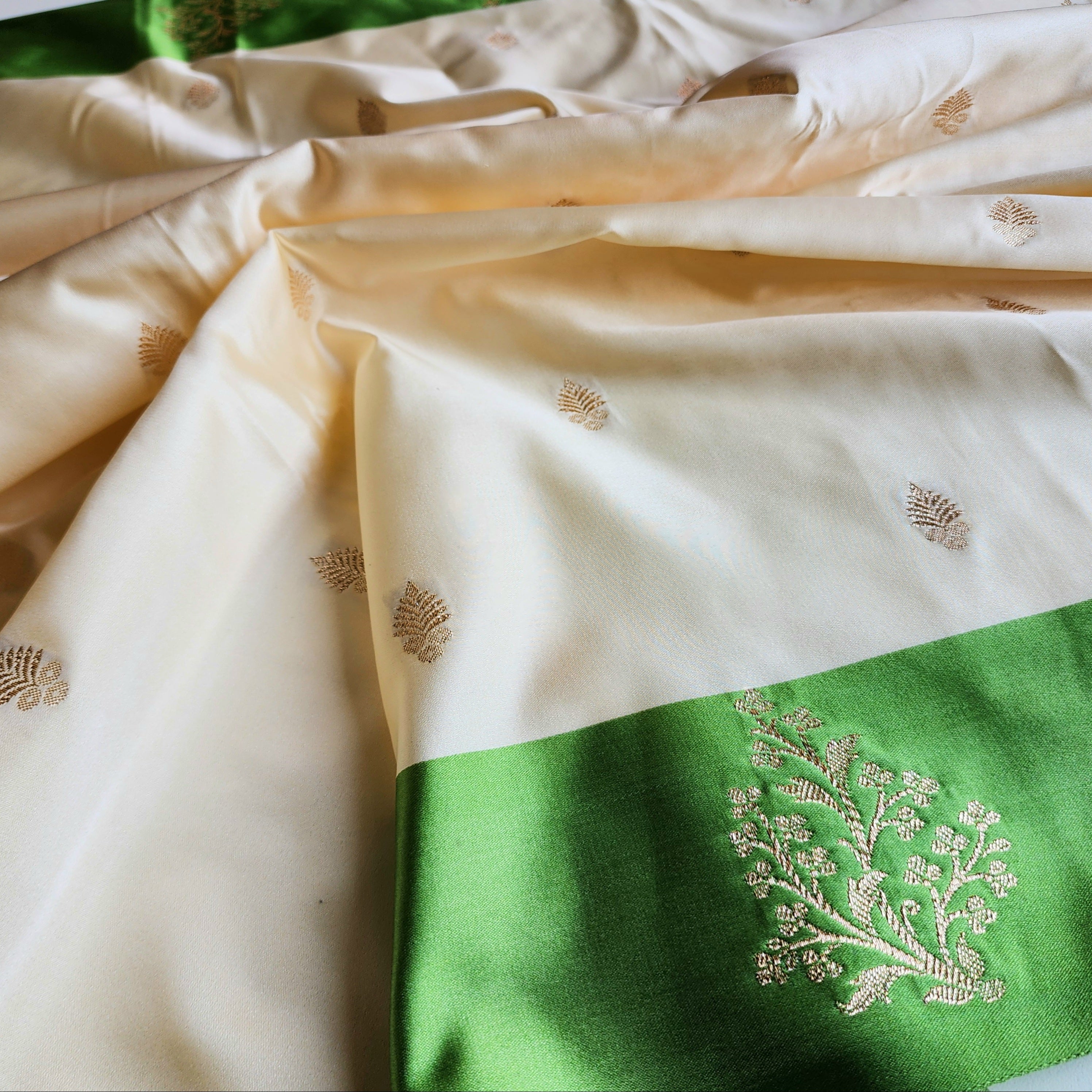 White Katan Silk Saree with Green and Gold Zari Border