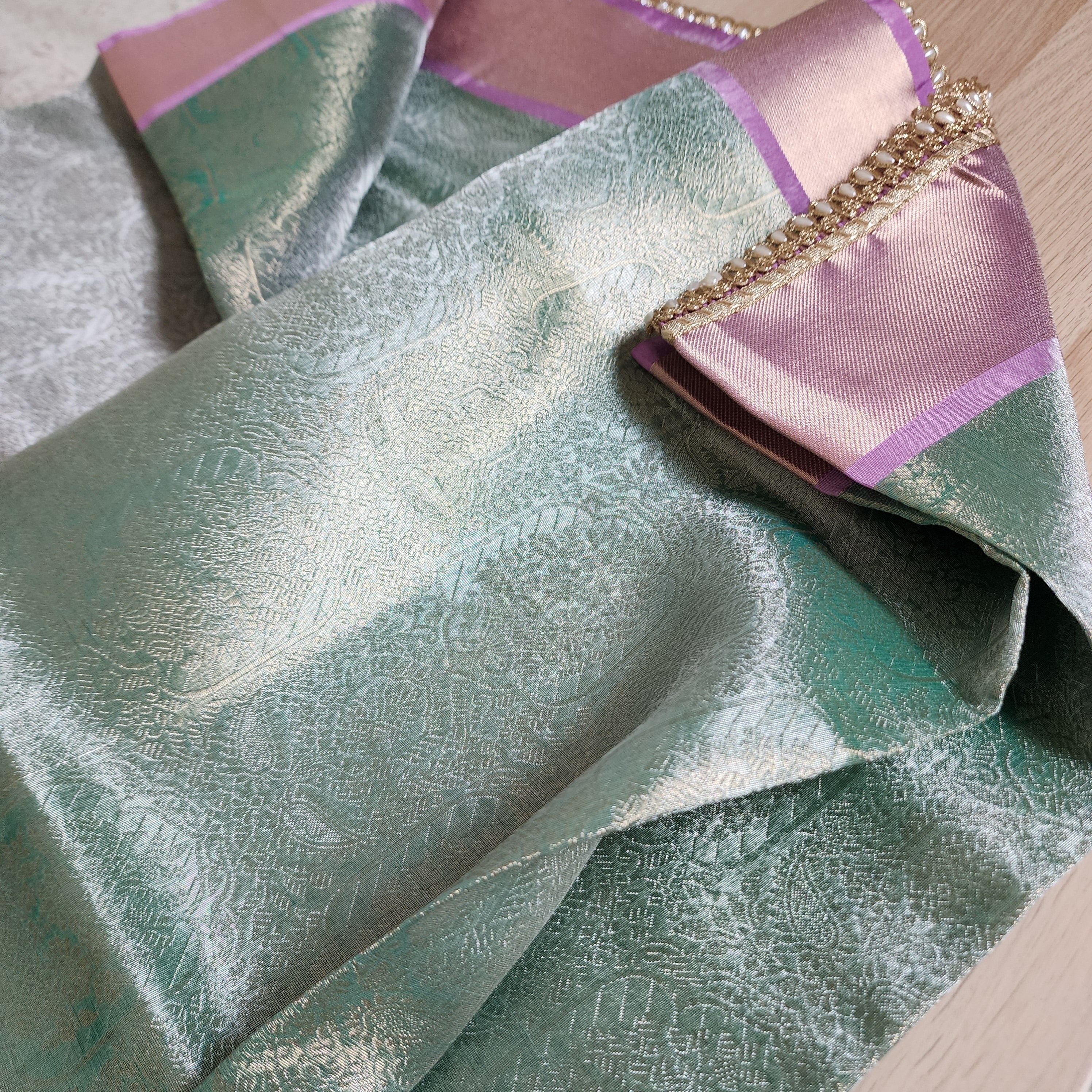 Pastel Sea Green and Pink Brocade Tissue Saree with beaded lace work