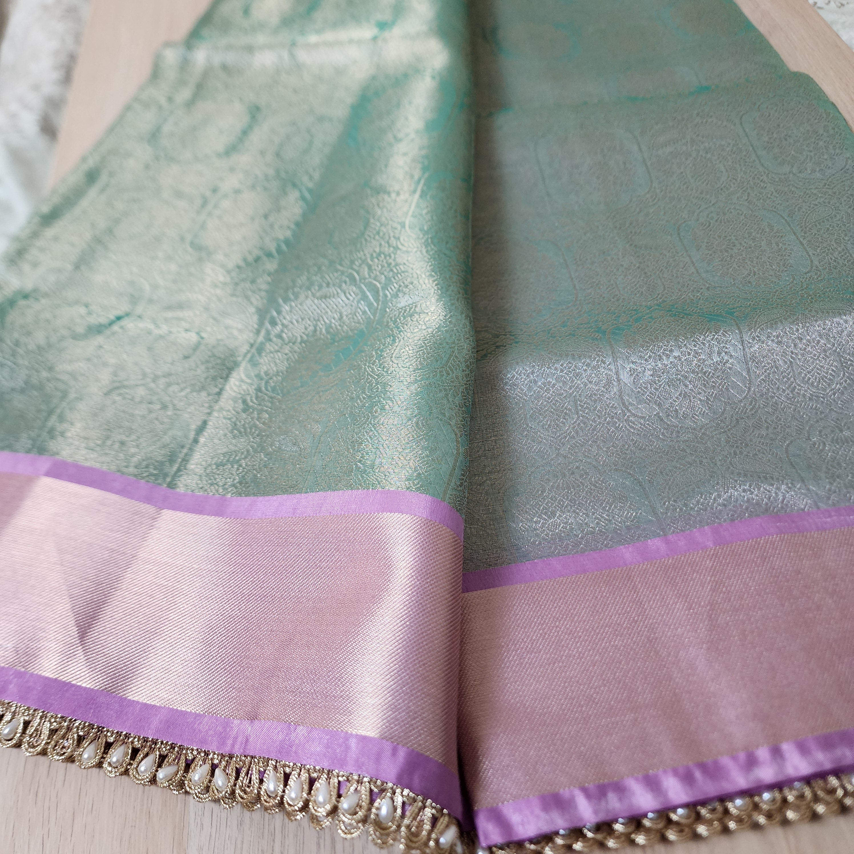 Pastel Sea Green and Pink Brocade Tissue Saree with beaded lace work
