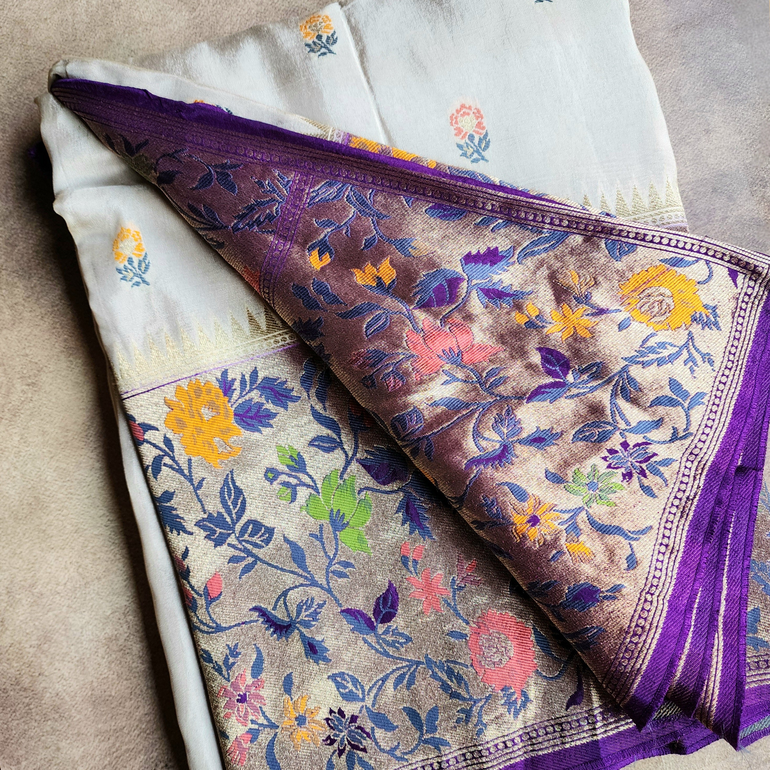 Soft Ivory Raw Silk Saree With Pastel Floral Weaving and Lilac Purple Border