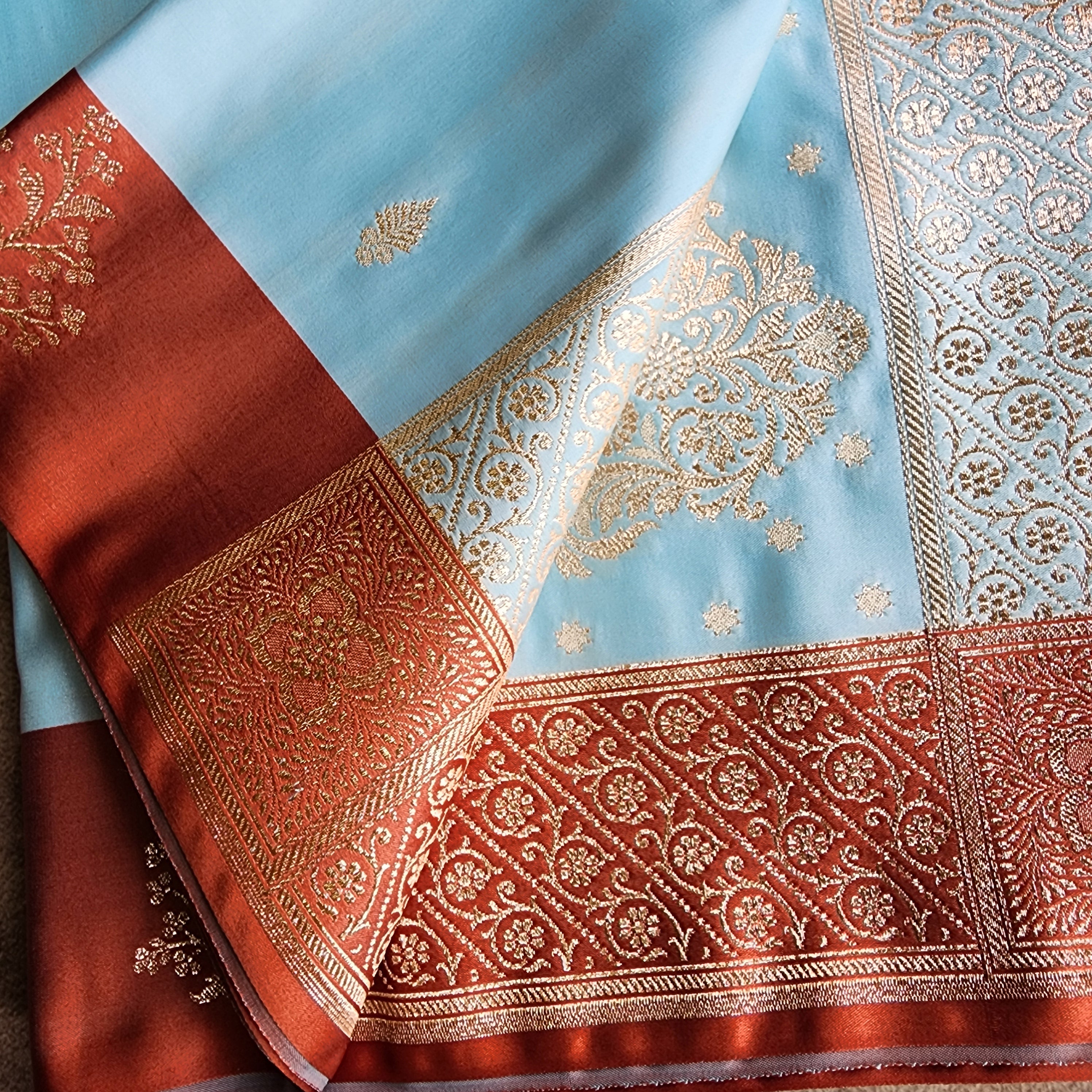 Powder Blue Katan Silk Saree with Rust Orange Gold Zari Border