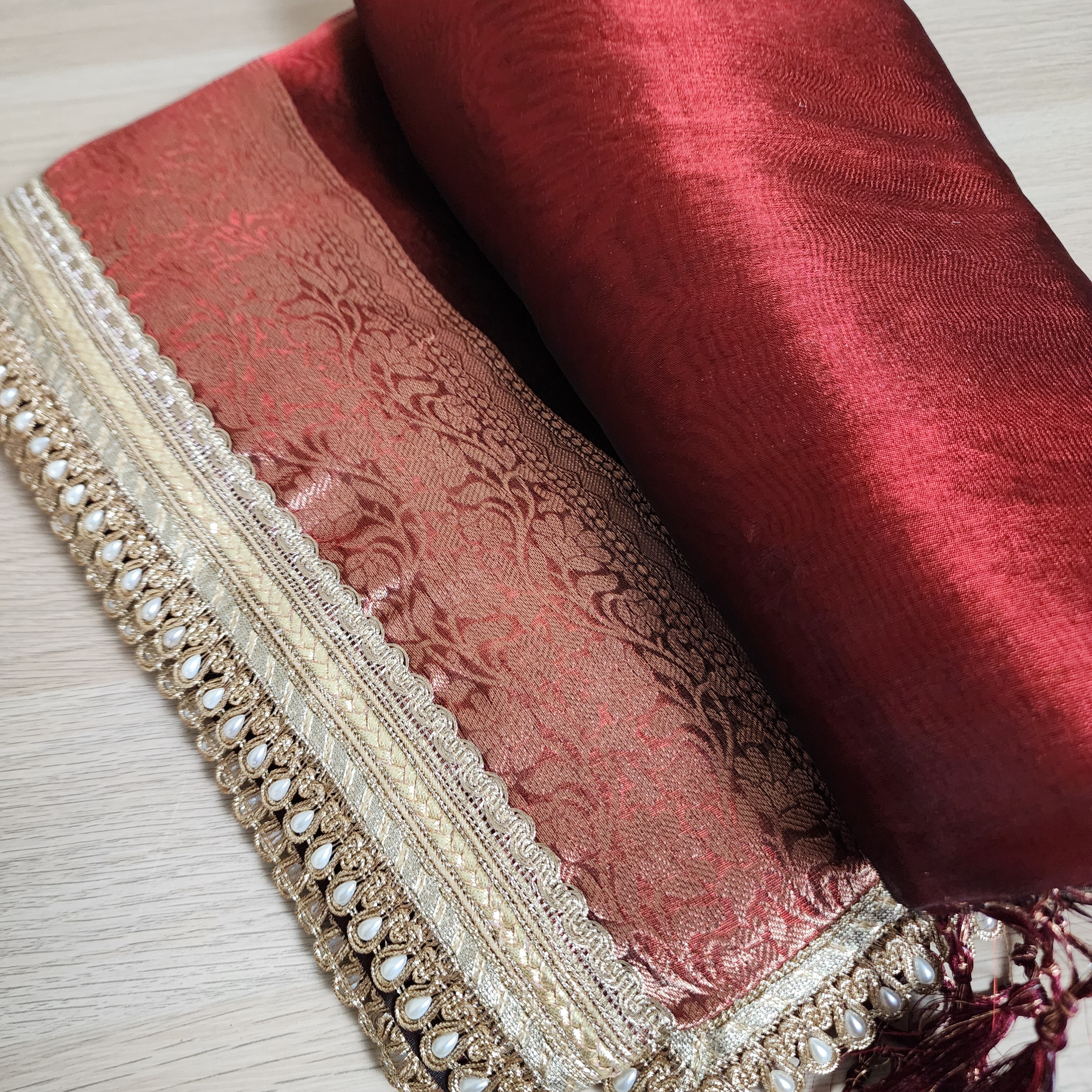 Carmine Red Tissue Silk Saree with beaded lace work