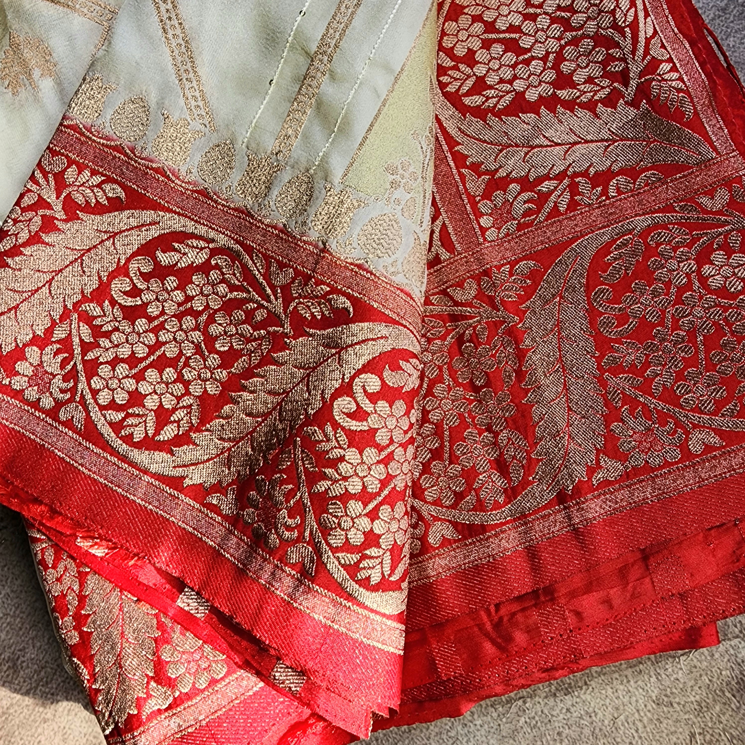 Rich White Crepe Georgette Silk Saree with Red Border and Gold Zari Detailing