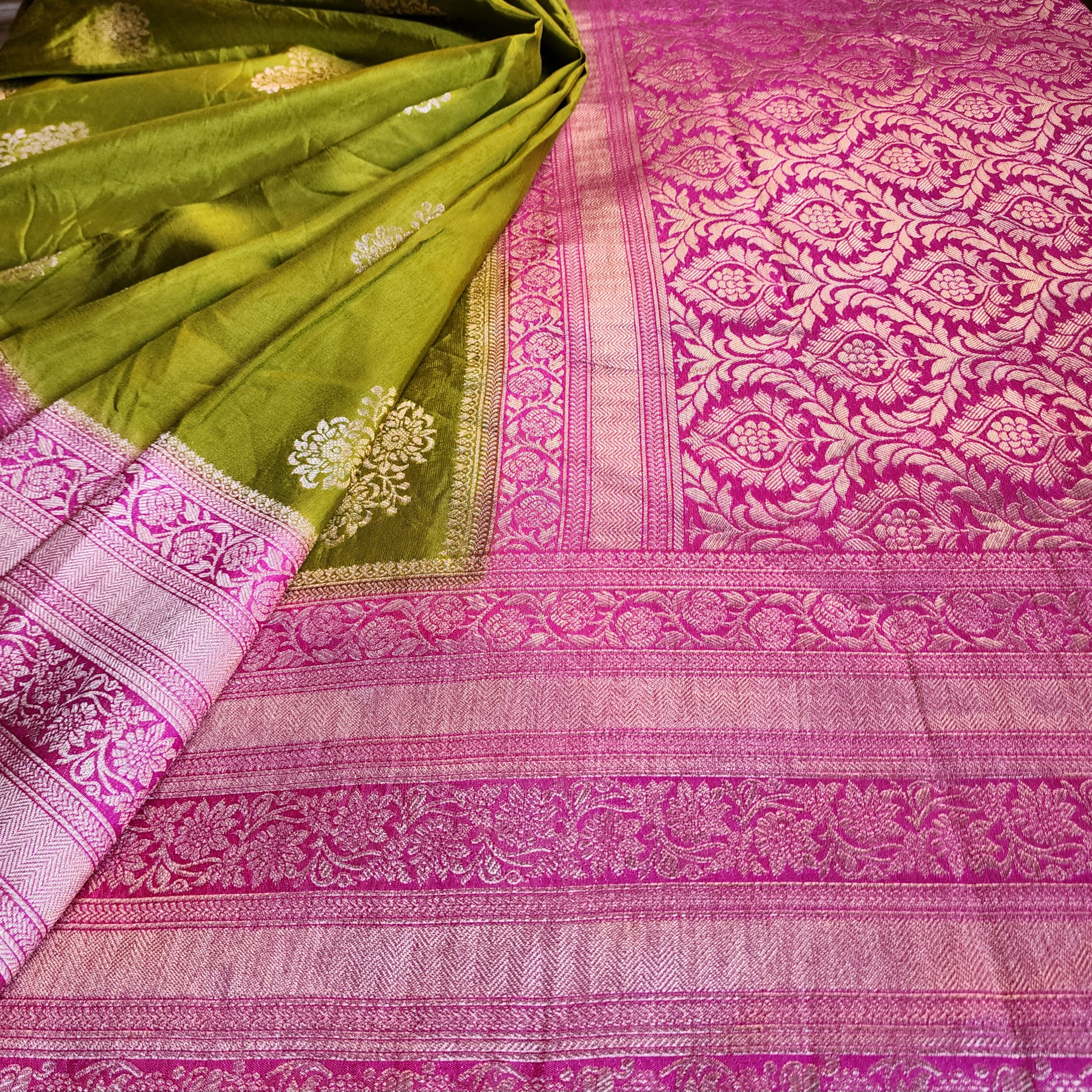 Olive Green Muslin Silk Saree with Traditional Silver Zari Work