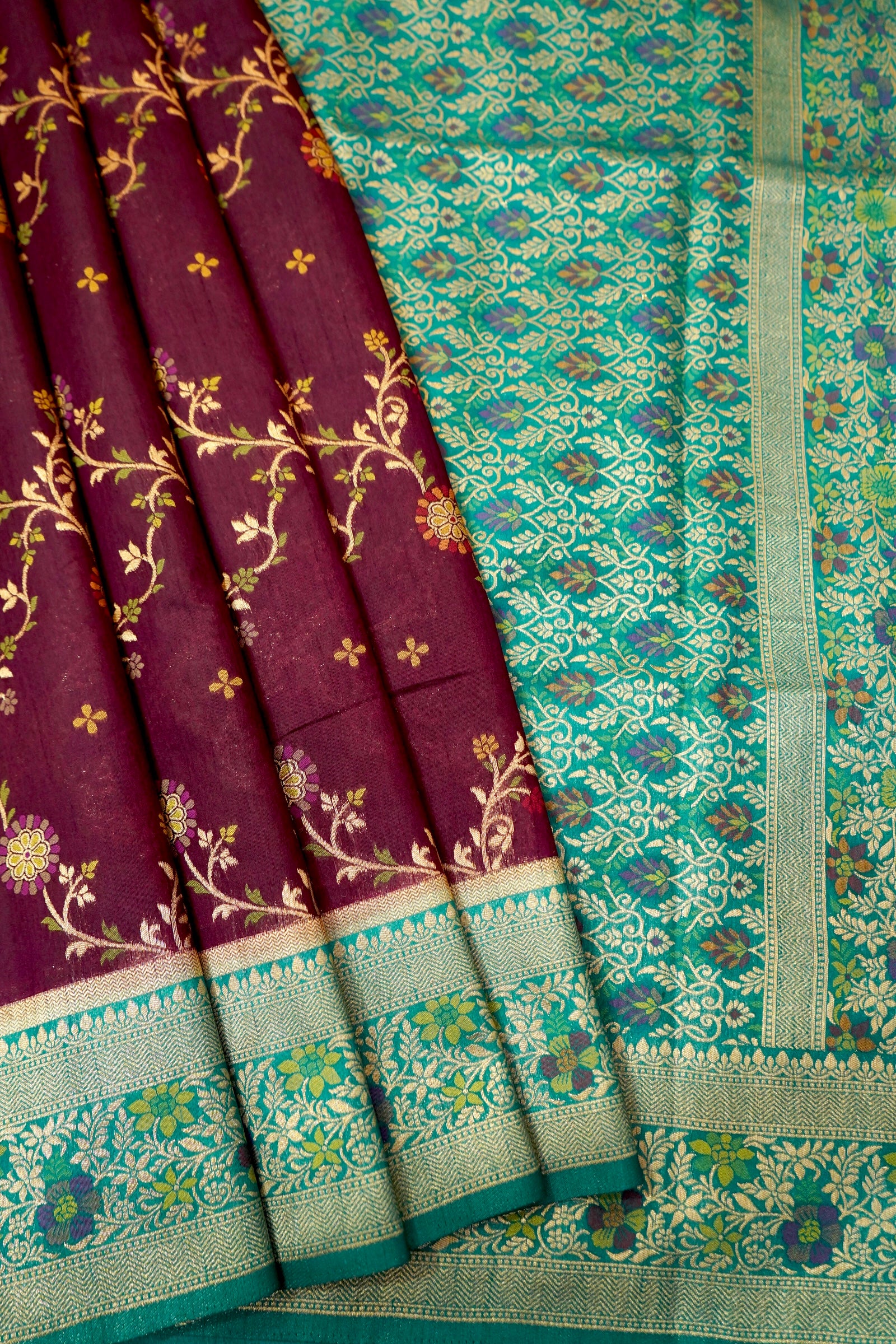 Wine Purple Dupion Patola Saree with Mint Green Border & Delicate Gold Zari Motifs