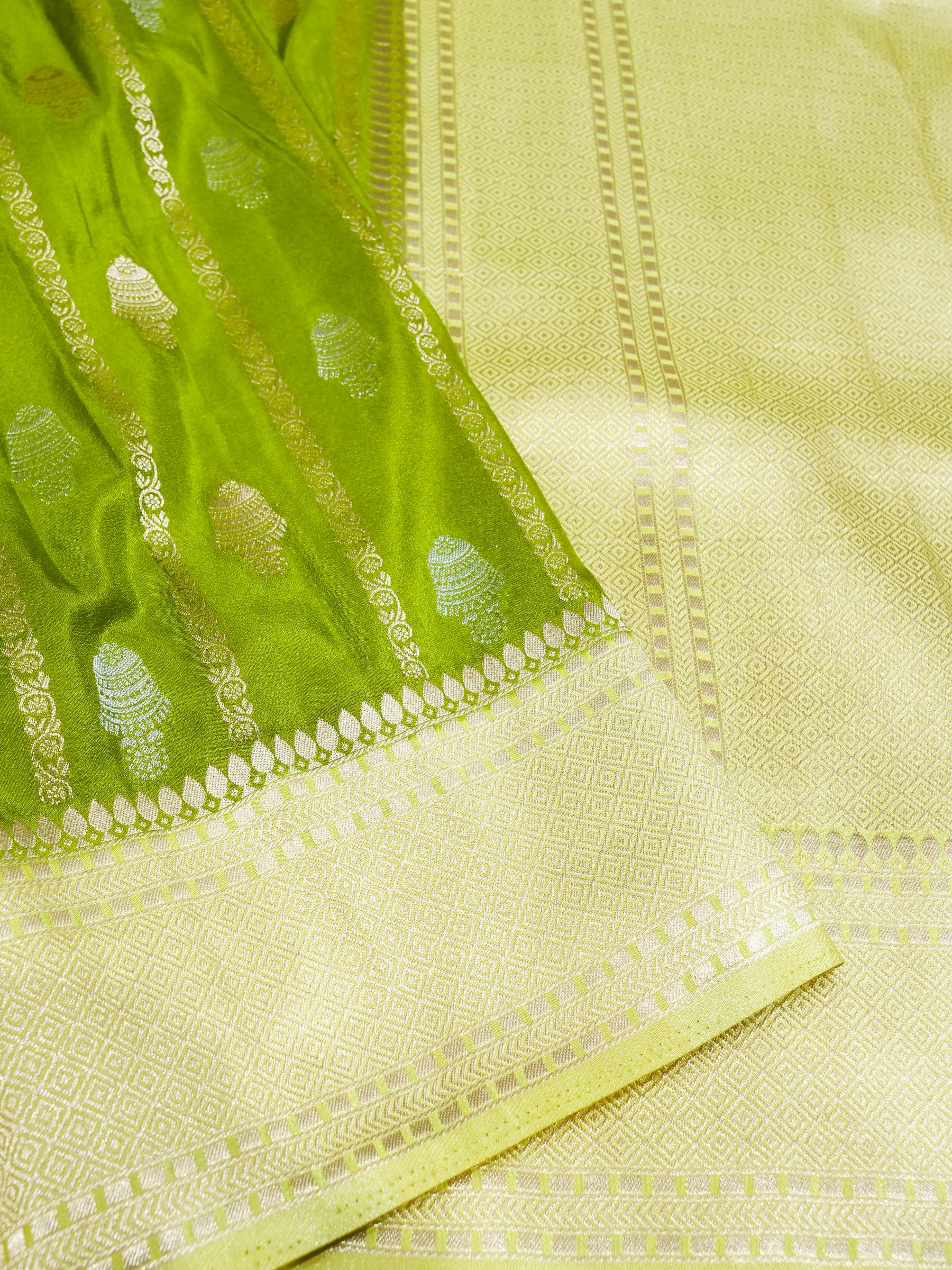 Parrot Green Crepe Georgette Silk Saree with Pale Gold Border